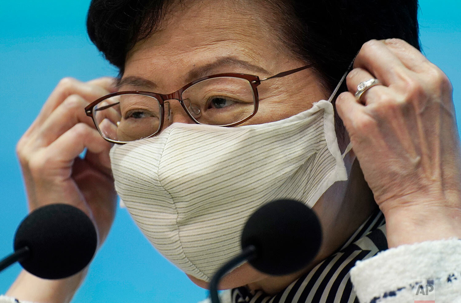  Hong Kong Chief Executive Carrie Lam adjusts her face mask during a press conference on the state of the coronavirus in Hong Kong, Tuesday, Sept. 1, 2020.  (AP Photo/Vincent Yu) 