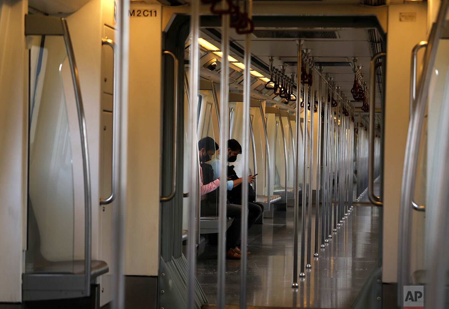  Commuters travel in an almost empty Delhi metro train in New Delhi, India, Monday, Sept. 7, 2020.  (AP Photo/Manish Swarup) 