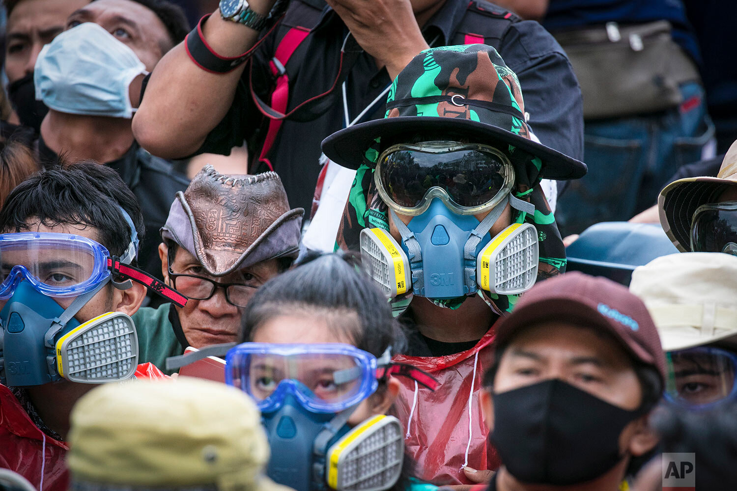  Pro-democracy protesters wear masks usually used to avoid tear gas during a protest in Bangkok, Thailand, Sunday, Sept. 20, 2020.  (AP Photo/Wason Wanichakorn) 