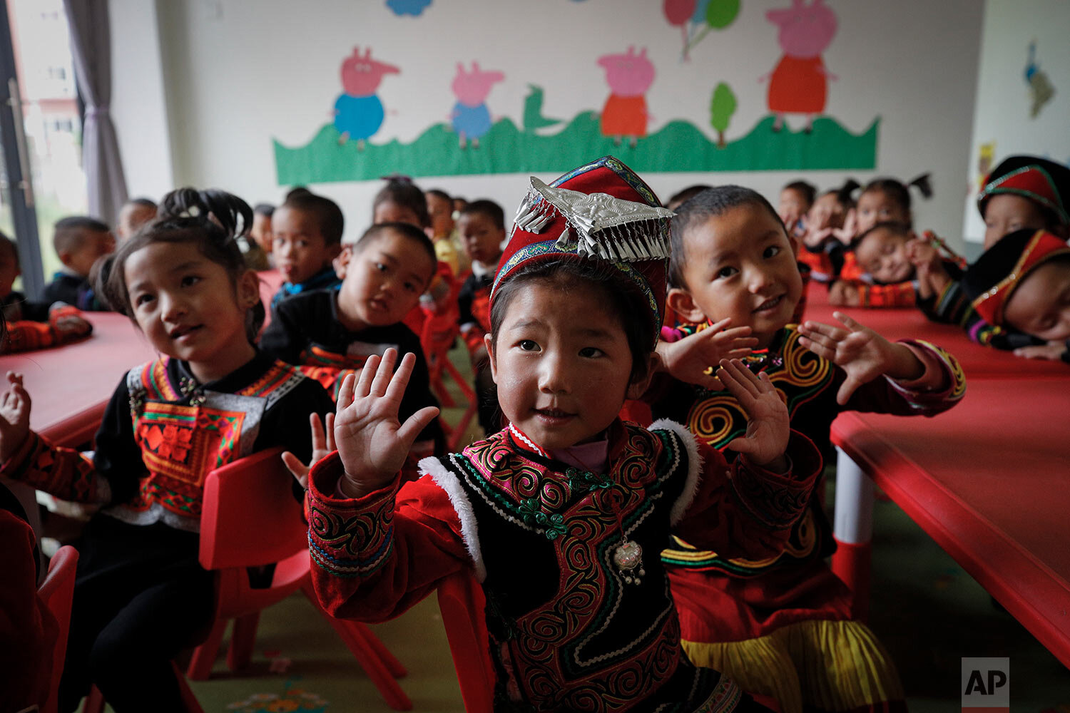  Ethnic minority children learn to sing at a kindergarten class at an apartment compound built by the Chinese government in Yuexi county, southwest China's Sichuan province on Sept. 11, 2020.  (AP Photo/Andy Wong) 