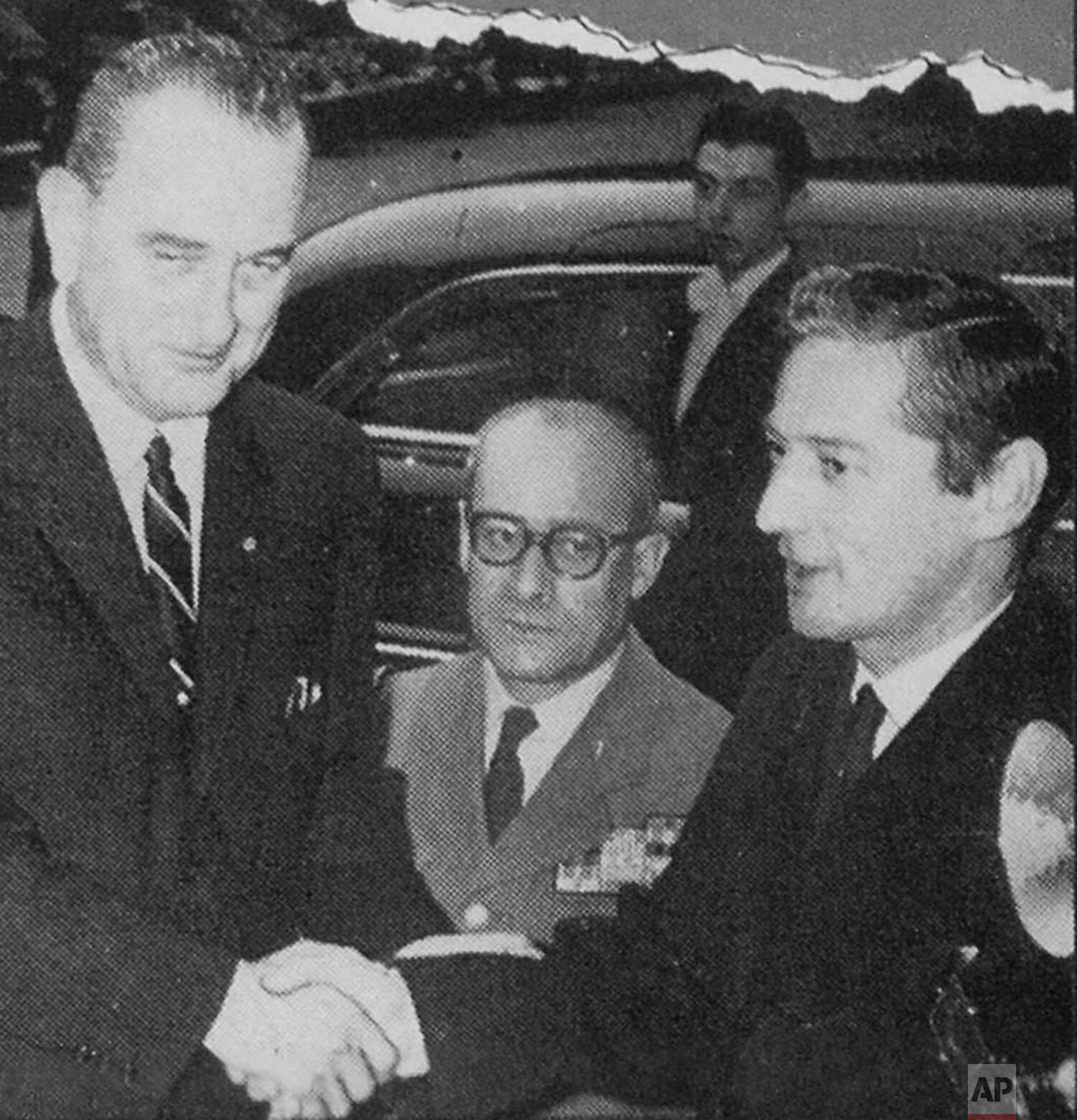  AP photographer Jean-Jacques Levy greets Vice President elect Lyndon Johnson, who was arriving to meet with Charles de Gaulle, in Paris, France. (AP Corporate Archives) 