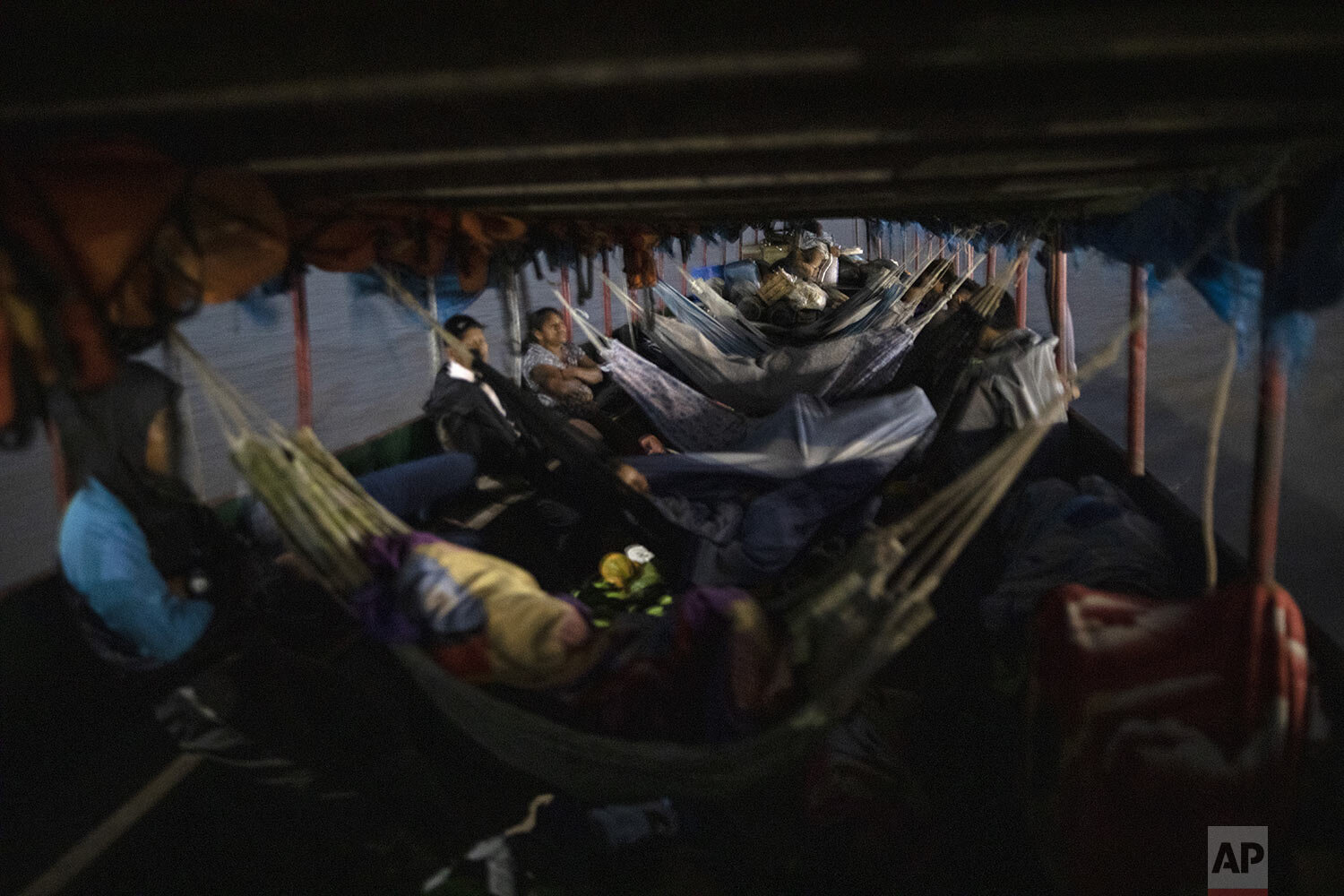  Commutes rest in hammocks as they travel on a public boat to Pucallpa, in Peru’s Ucayali region, Peru, Monday, Oct. 5, 2020. (AP Photo/Rodrigo Abd) 