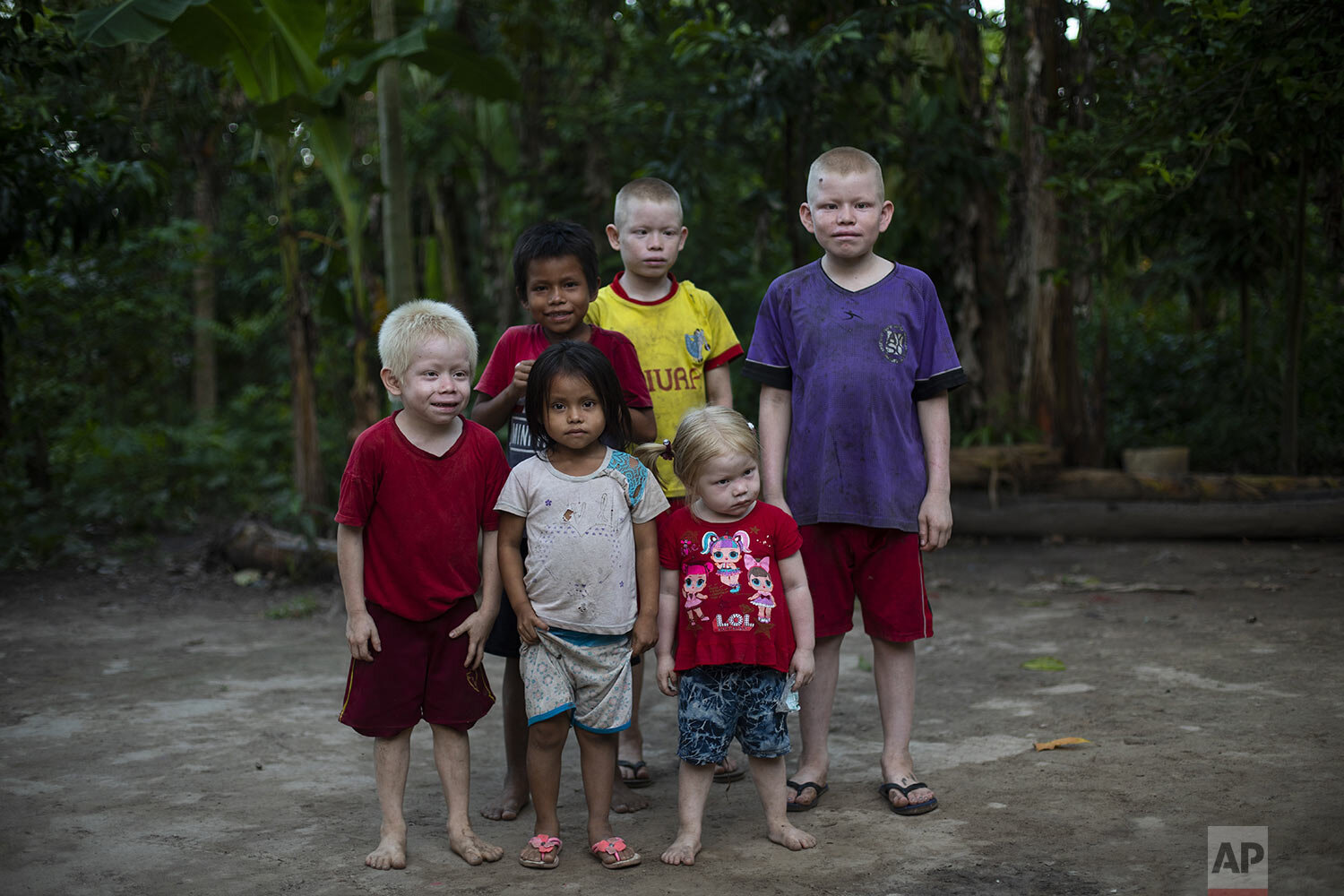  Siblings from left to right; Ender, 6, Gisell, 4, Diere, 9, Baker, 11, Ashley, 3, Watson, 12, pose ffor a photo near their home in Palestina, in Peru’s Ucayali region, Wednesday, Sept. 30, 2020. Their 36-year-old father Ender Rengifo told The Associ