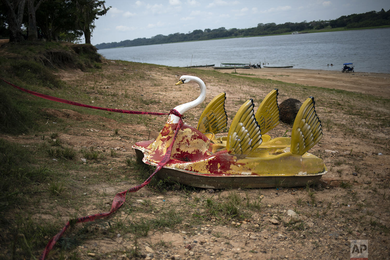  A rental pedal boat sits idle on the banks of the Yarinacocha Lagoon, in the Ucayali region, Peru, Thursday, Oct. 8, 2020. (AP Photo/Rodrigo Abd) 