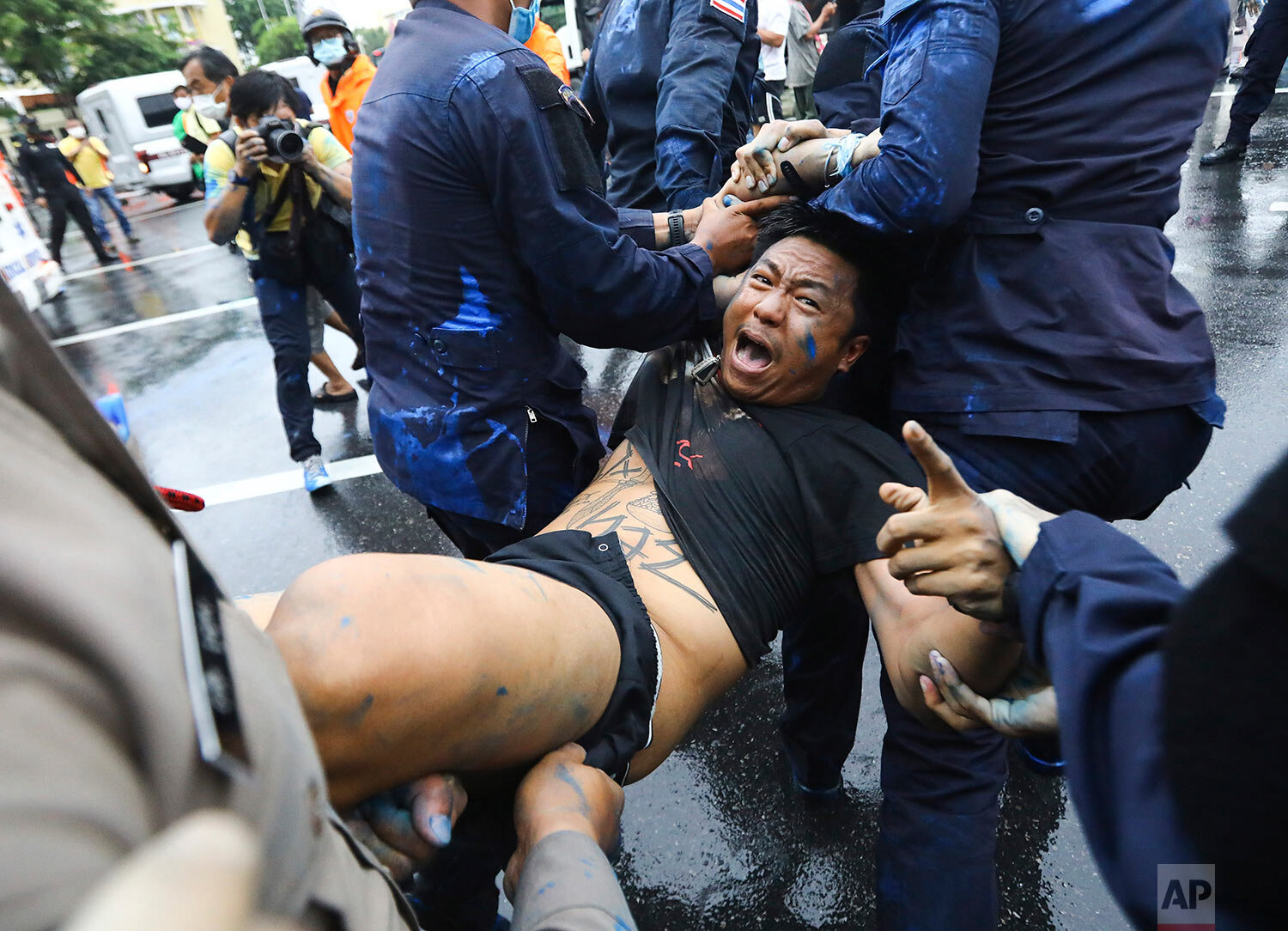  Police arrest activist Jatupat Boonpattararaksa near the Democracy Monument in Bangkok, Thailand, Tuesday, Oct. 13, 2020.  (AP Photo) 