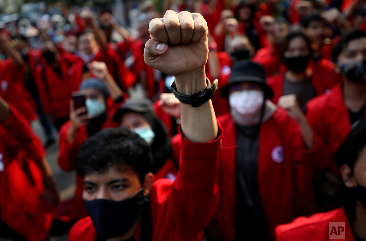  Student protesters raise their fists as they chant slogans during a protest against a new Job Creation Law in Jakarta, Indonesia, Wednesday, Oct. 28, 2020.  (AP Photo/Dita Alangkara) 