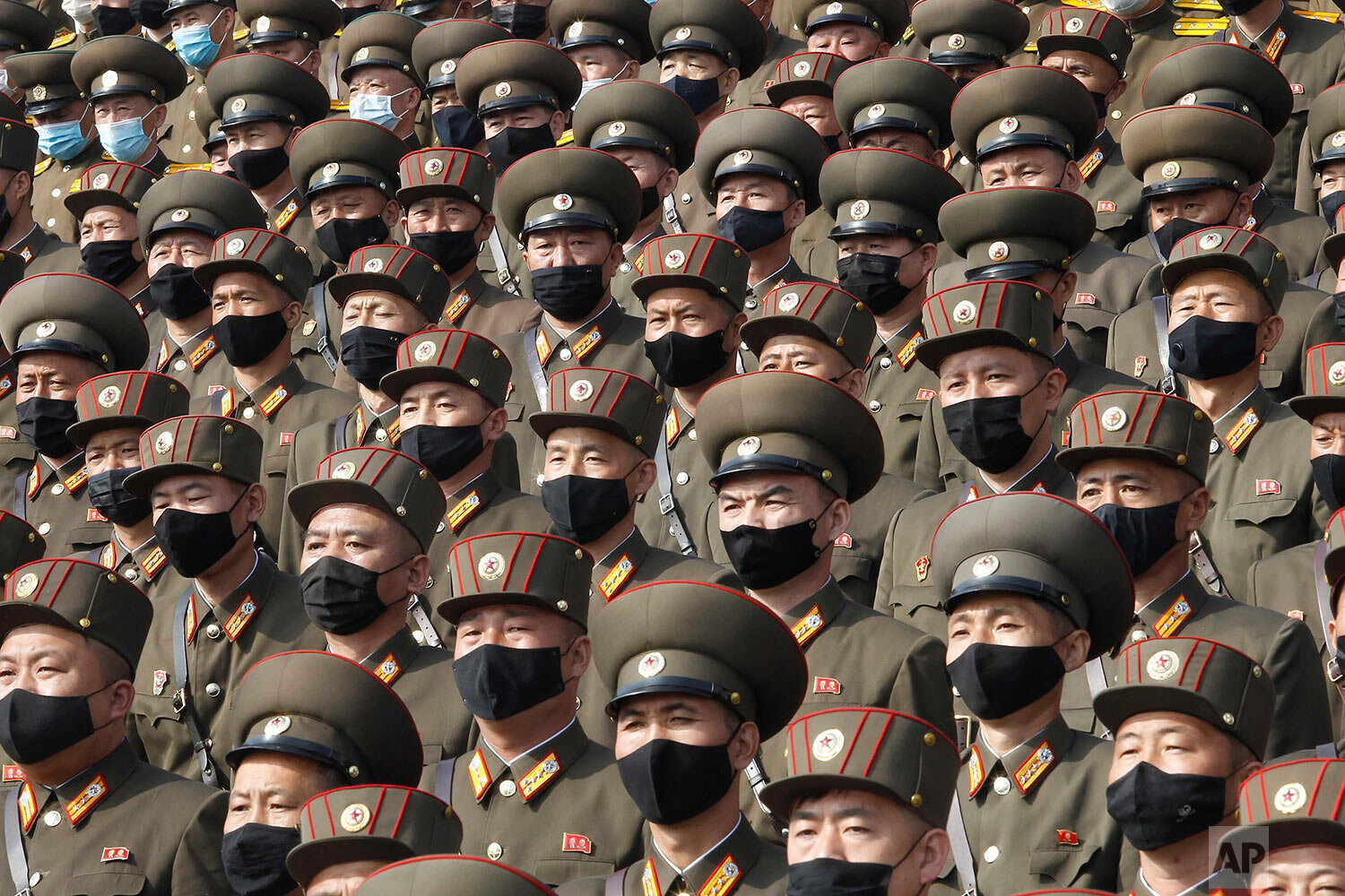  Soldiers wearing face masks to help curb the spread of the coronavirus rally to welcome the 8th Congress of the Workers' Party of Korea at Kim Il Sung Square in Pyongyang, North Korea, Monday, Oct. 12, 2020. (AP Photo/Jon Chol Jin) 