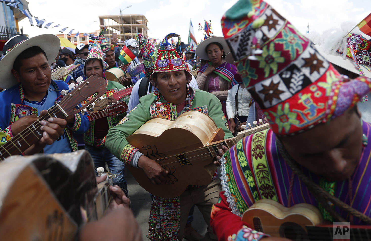  Indigenous Quechua musicians take part in celebration festivities after a final official vote count released yesterday declared Luis Arce the winner of the presidential election, in El Alto, Bolivia, Oct. 24, 2020. (AP Photo/Juan Karita) 