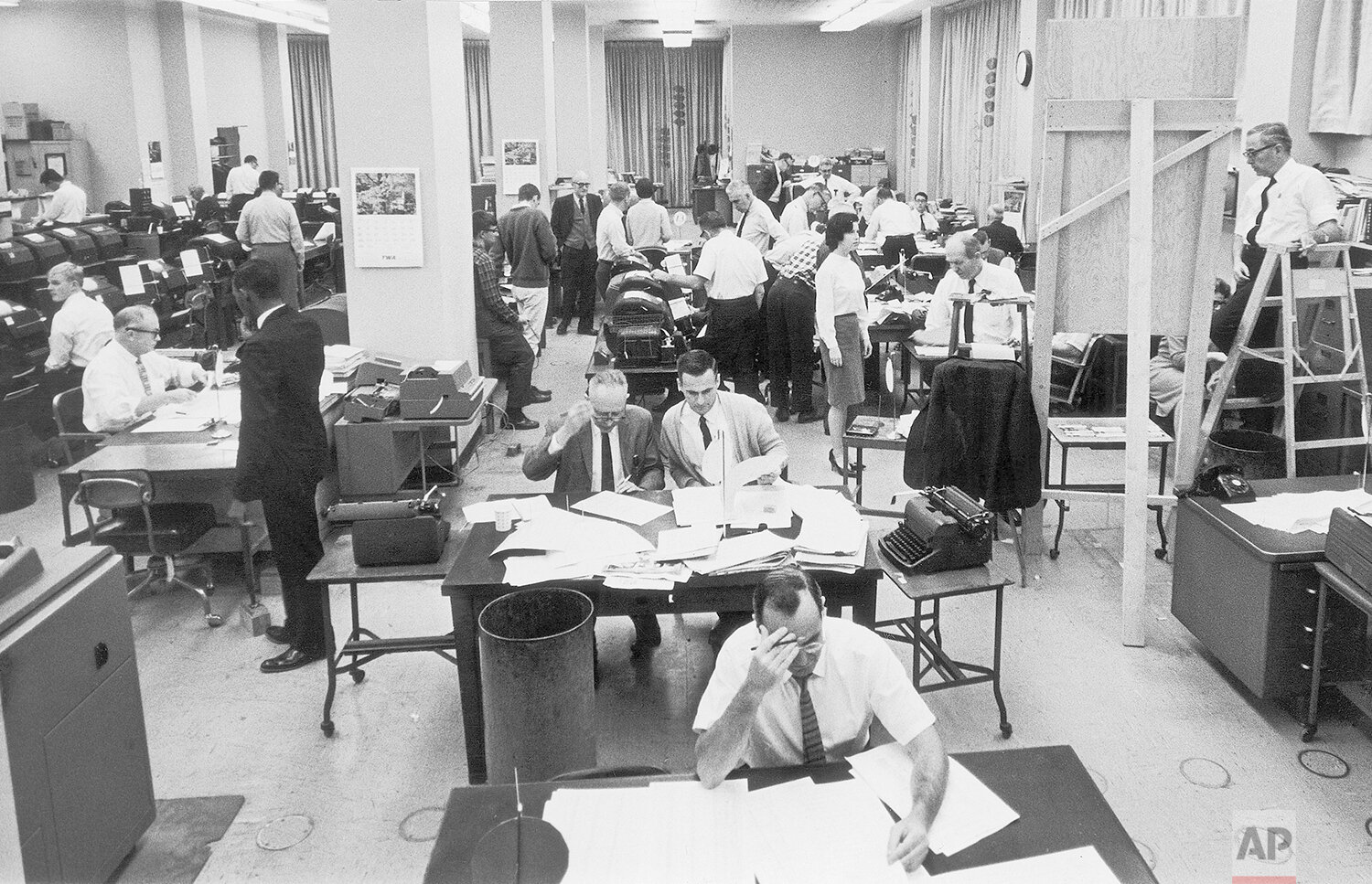  Staffers work on election night at the Washington bureau of The Associated Press on Nov. 3, 1964. (AP Photo/File) 