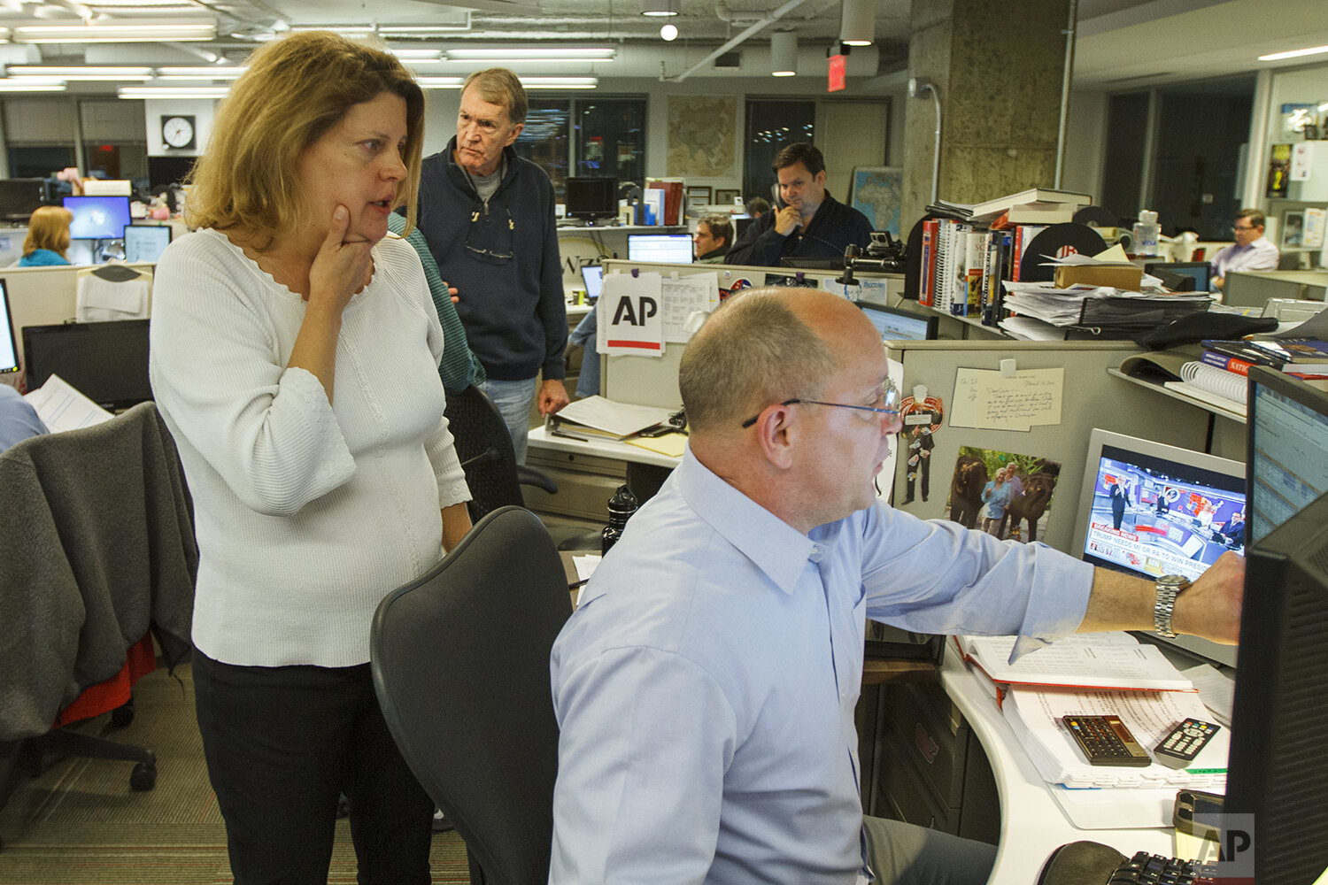  Then-Associated Press Washington bureau chief Sally Buzbee, talks with Stephen Ohlemacher, who in 2020 is the decision desk editor, in the early morning hours of Wednesday, Nov. 9, 2016, at the Washington bureau of The Associated Press during electi