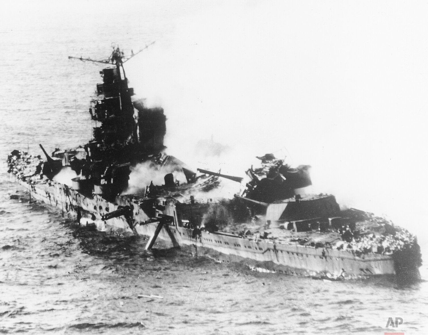  During the Battle of Midway, a Japanese heavy cruiser of the Mogami class lies low in the water after being bombed by U.S. Naval aircraft, in May 1942. (AP Photo) 