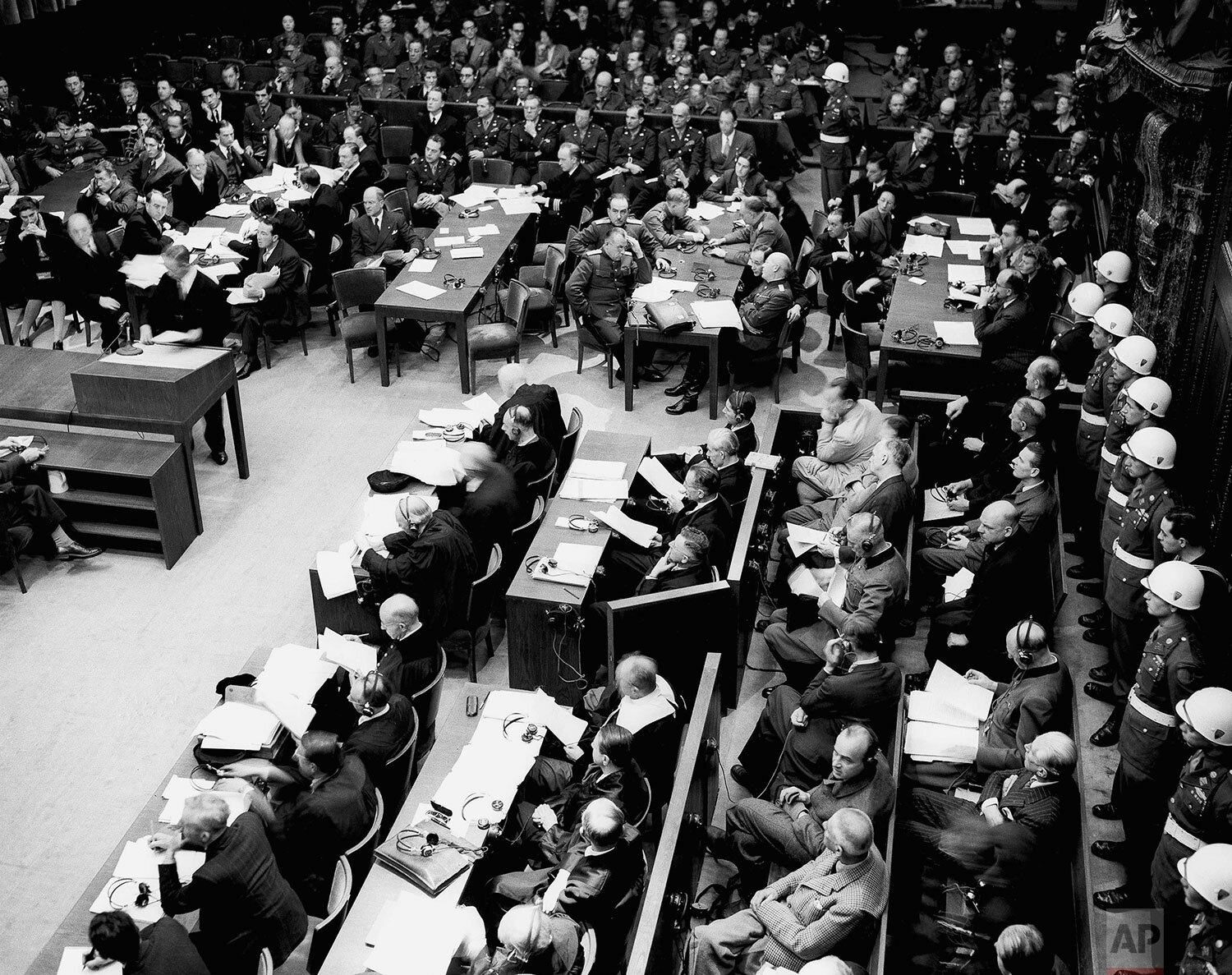  A general view of the courtroom during the first morning session in Nuremberg on Nov. 20, 1945. In foreground, left, sit the defendants with a row of guards behind them and their counsel sitting in front of them. (AP Photo/B.I. Sanders) 