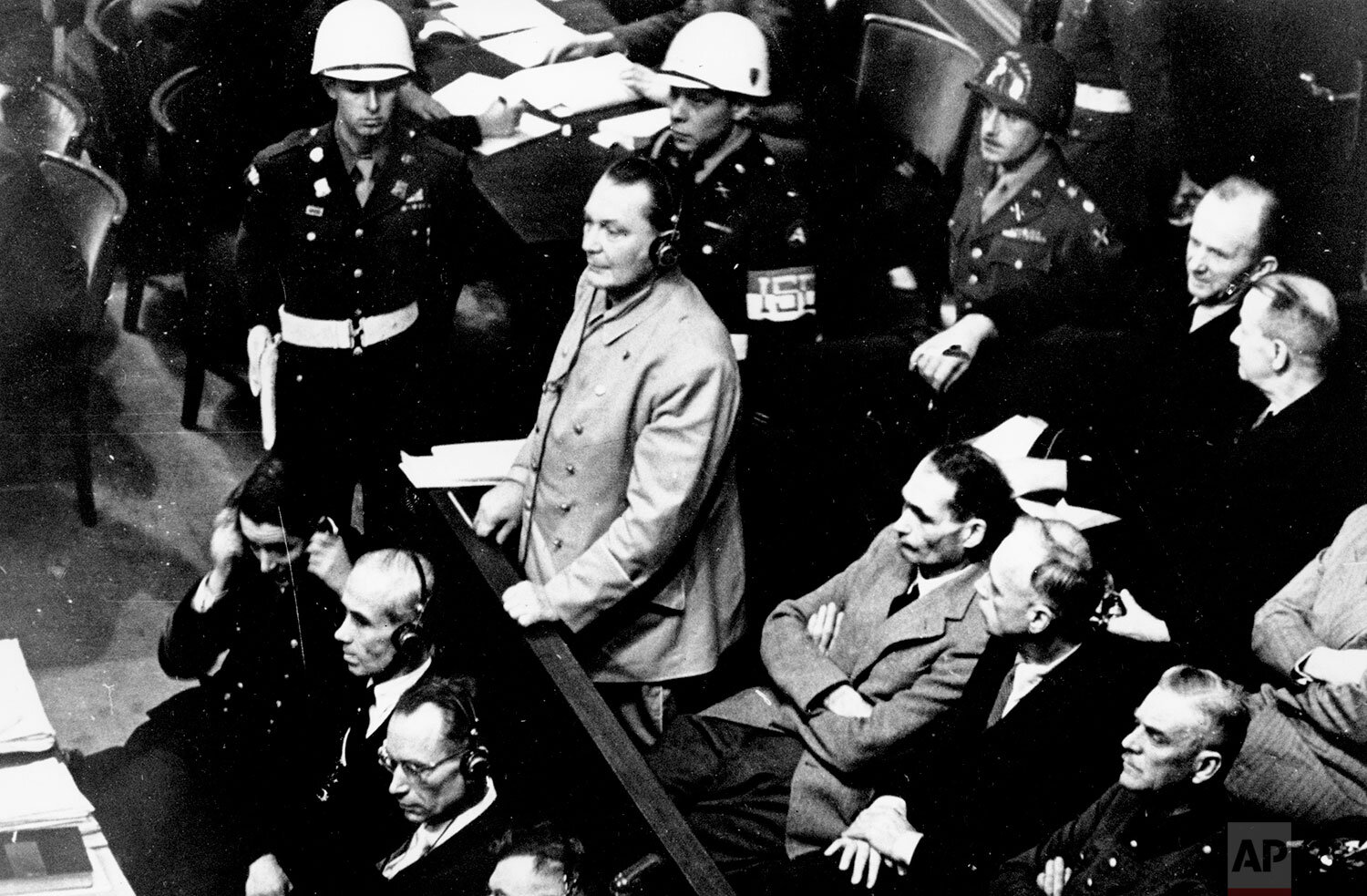  Reichsmarshal Hermann Goering stands in the prisoner's dock at the Nuremberg War Crimes Trial in Germany on Nov. 21, 1945.  He is entering a plea of not guilty to the International Military Tribunal Indictment. Goering is wearing headphones of the c