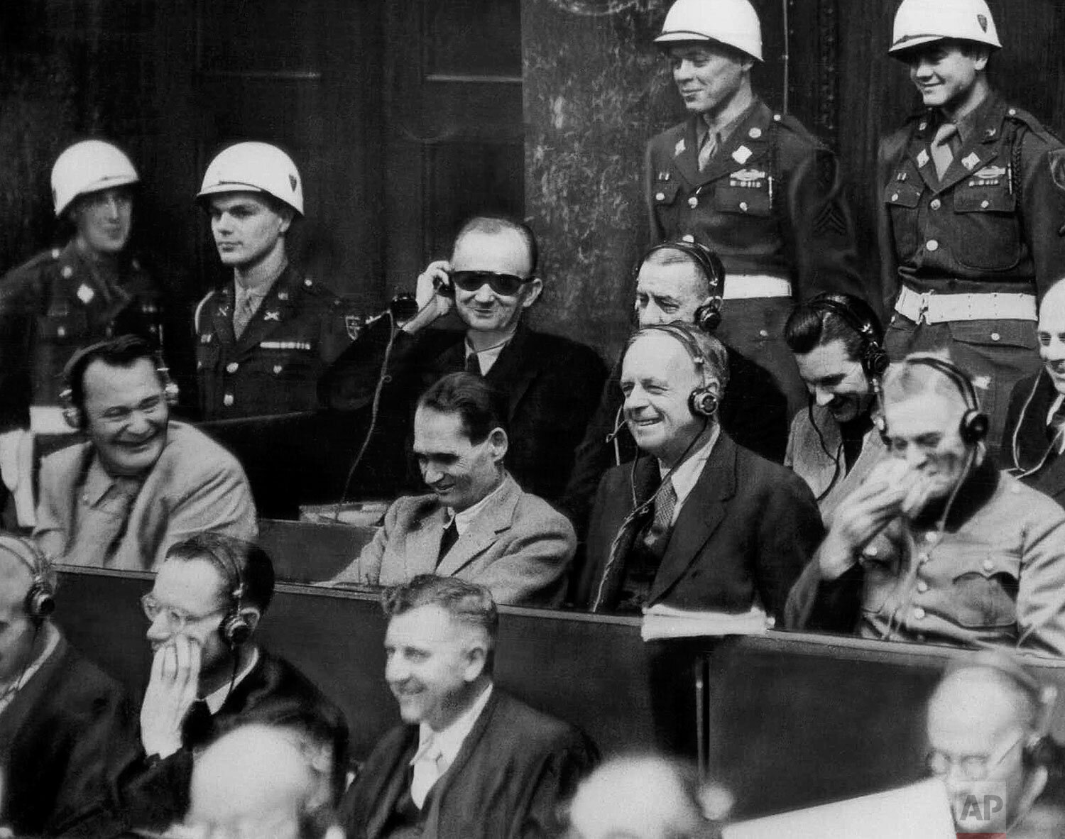  With Hermann Goering, left, getting the biggest laugh out of the proceeding, Nazi war criminals break out into laughter as evidence is introduced at Nuremberg, Germany on Nov. 30, 1945. Even the American guards enjoy the ‘joke.’ In the front row of 