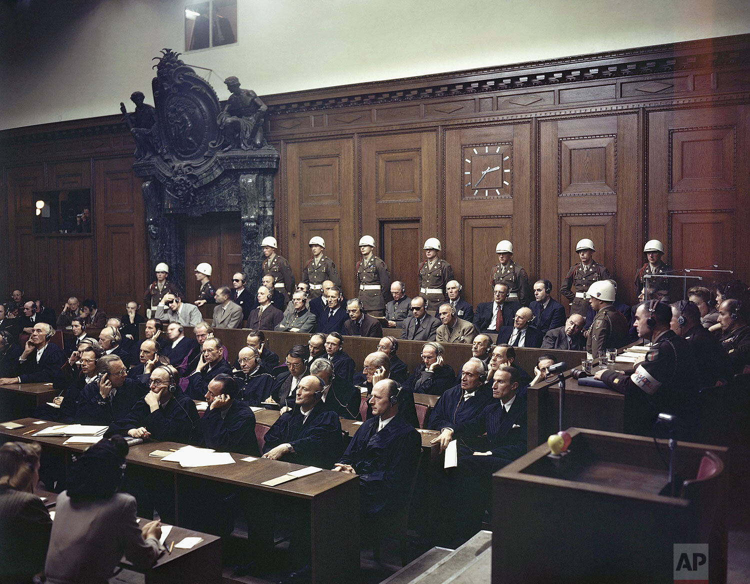 Defendants listen to part of the verdict in the Palace of Justice during the Nuremberg War Crimes Trial in Nuremberg, Germany on Sept. 30, 1946. Seated in the first row in the prisoner's dock are, from left: Hermann Goering, wearing dark glasses; Ru
