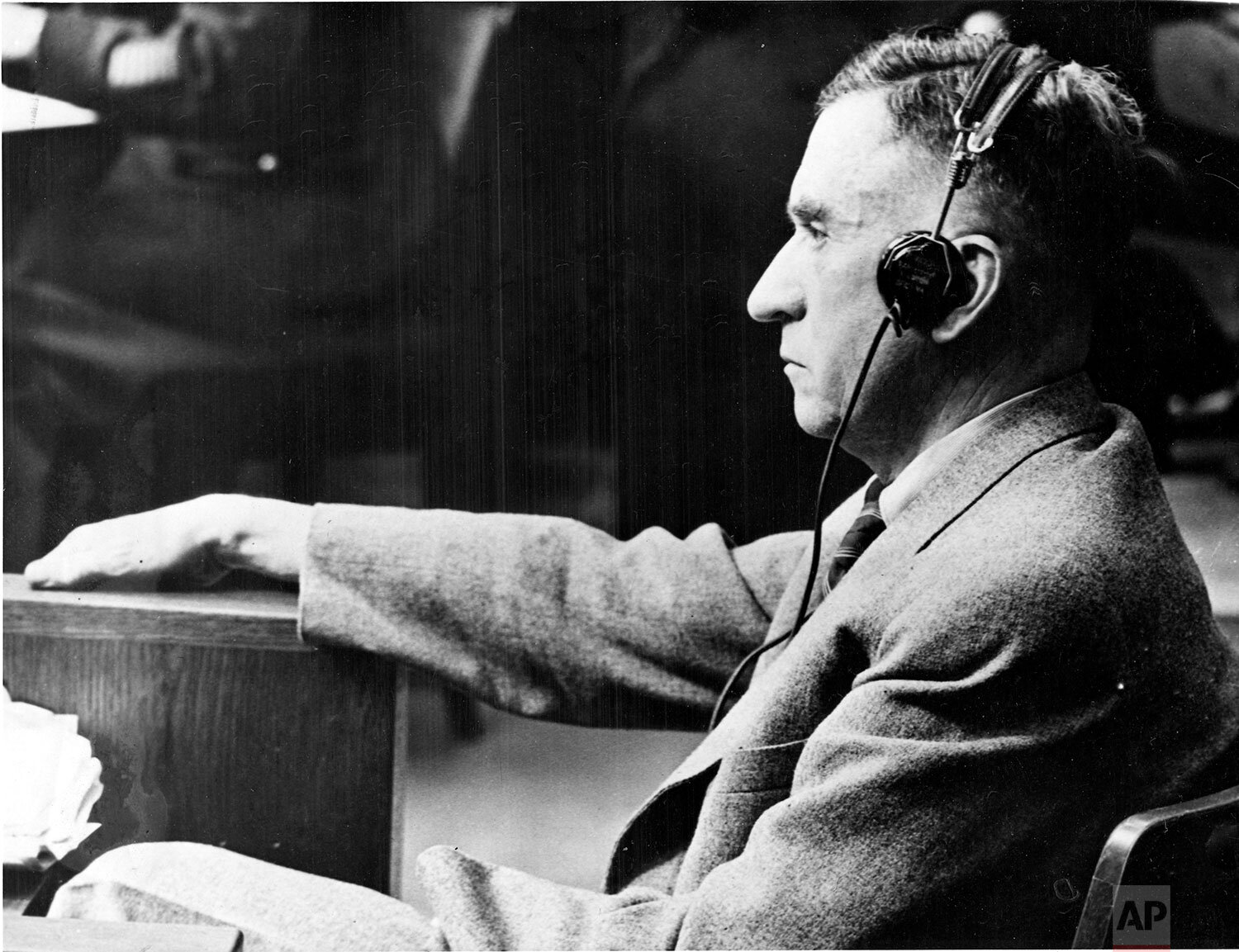  Carl Krauch, the main defendant of case 6 and former chairman of the managing board of directors of the I.G. Farben Cemical Industries, takes the stand to testify in his own defense at the U.S. Military Tribunal in Nuremberg, Germany, January 13, 19
