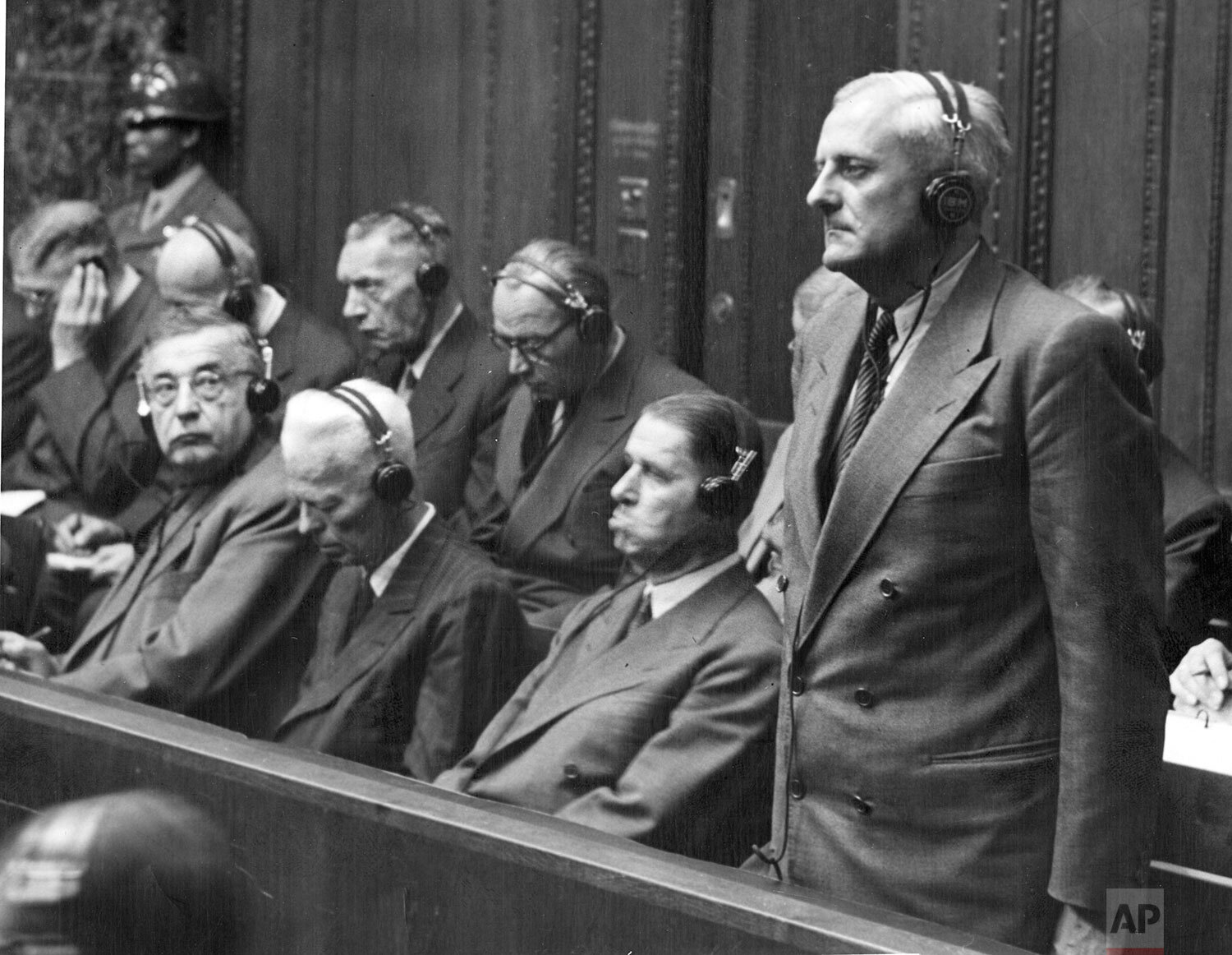  Otto Ambros, standing, listens to his verdict of eight years in prison by the U.S. Military Tribunal in Nuremberg, Germany, July 30, 1948. Ambros was chief of the chemical warfare Committee of the Ministry for Araments and War Production and manager