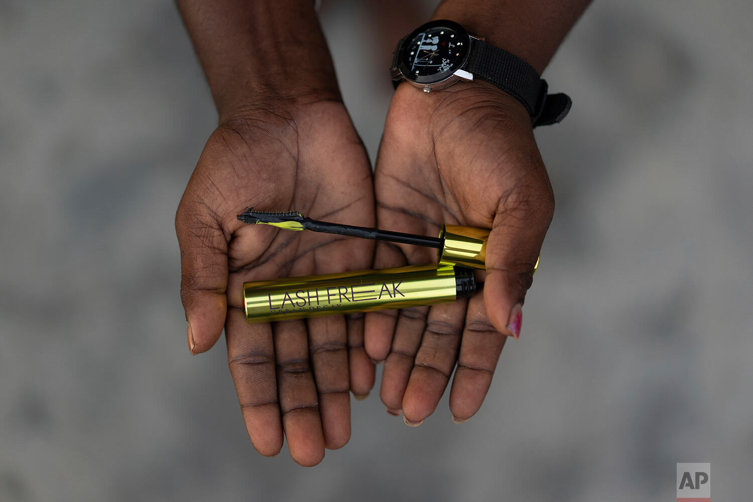  A 27-year-old woman poses with a mascara popular with Gen Z buyers in Malaysia, on Wednesday, Nov. 11, 2020. She quit school at 14 and went to work on the plantation as all the women before her had done. She said she never really saw any other life 