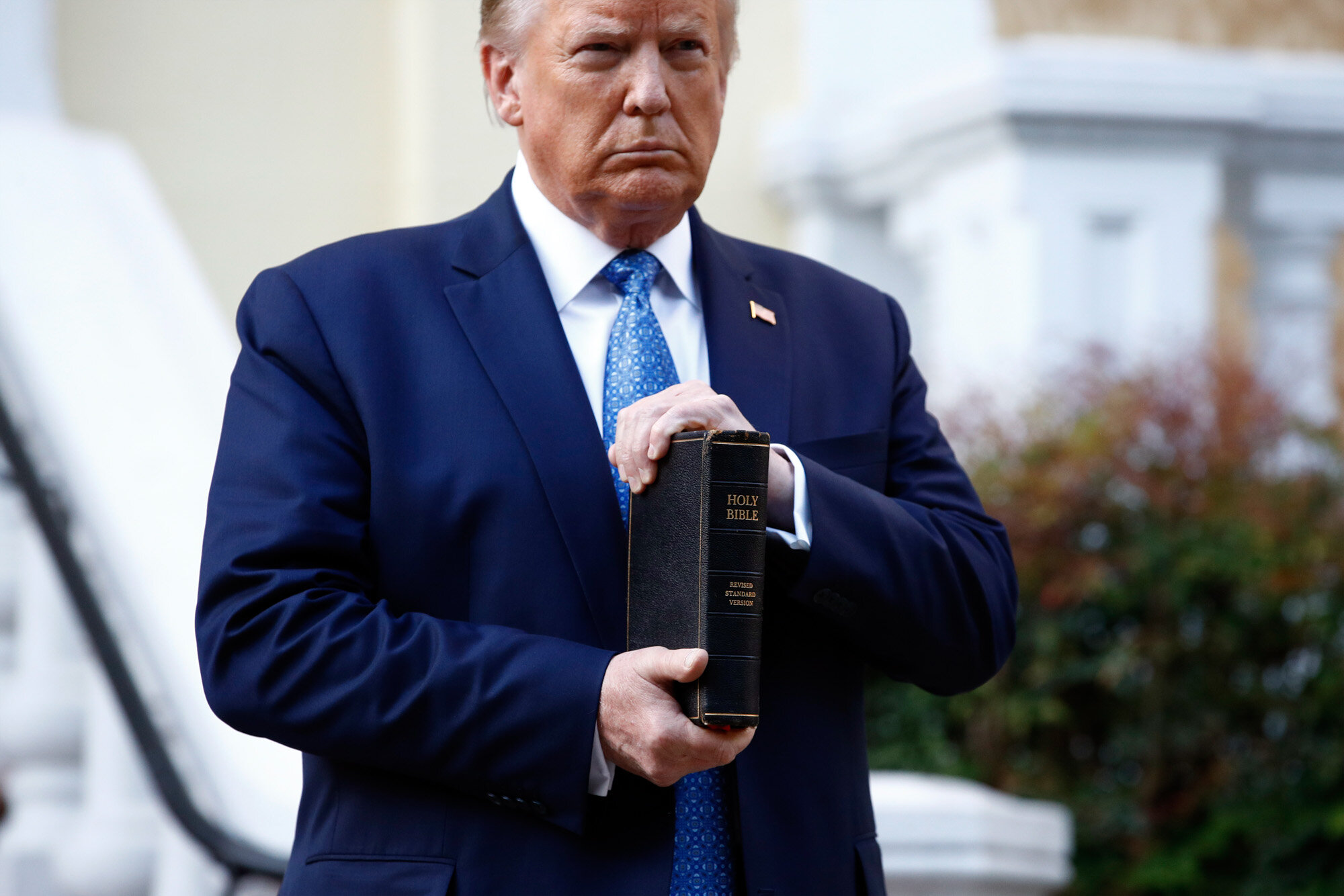  President Donald Trump holds a Bible as he stands outside St. John's Church across Lafayette Park from the White House in Washington on June 1, 2020, after law enforcement officers used tear gas and other riot control tactics to forcefully clear pea
