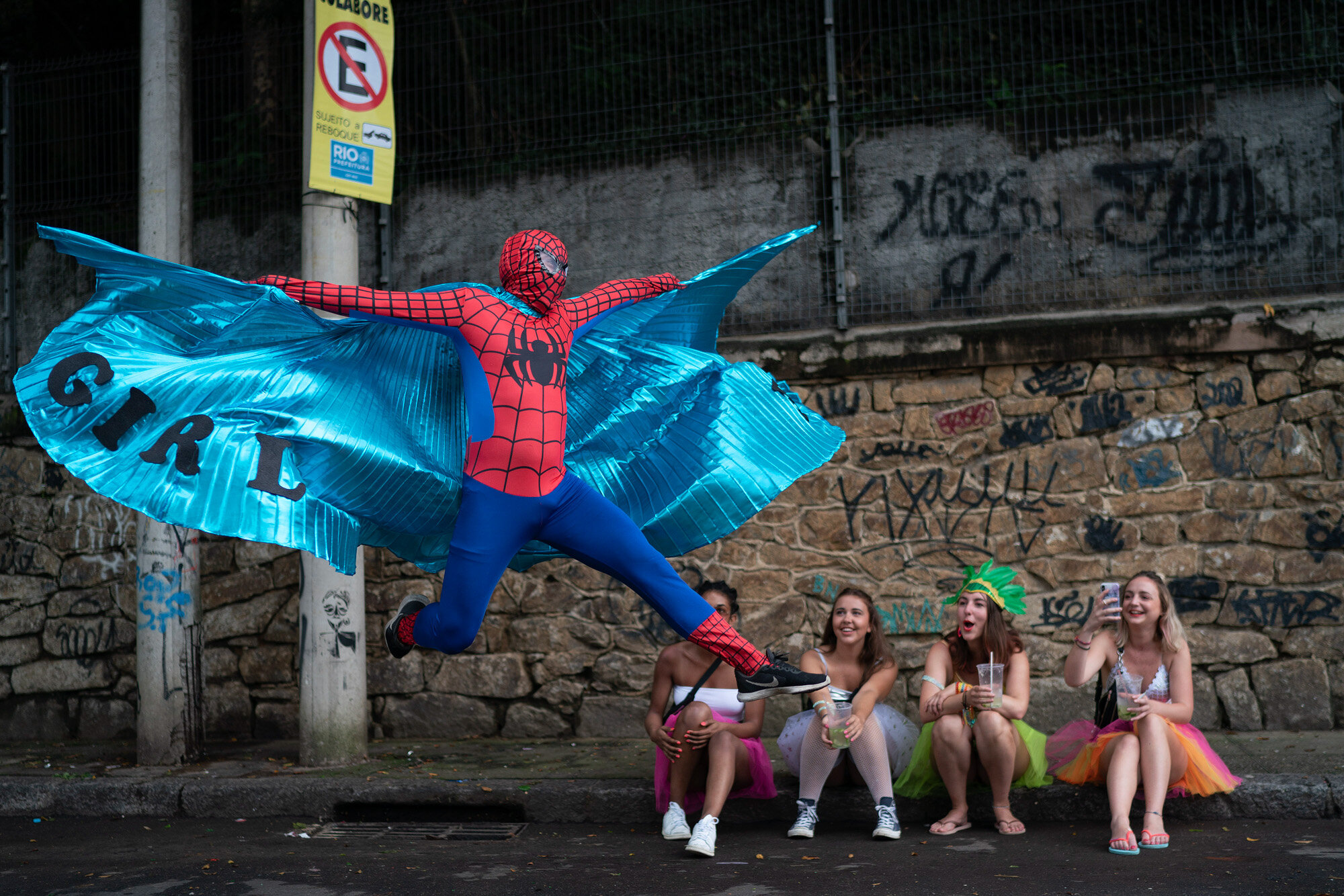  A reveler dressed in a Spider-Man costume strikes a pose at the "Ceu na Terra" or Heaven on Earth street party in Rio de Janeiro, Brazil on Feb. 22, 2020, during the Carnival celebration. (AP Photo/Leo Correa) 