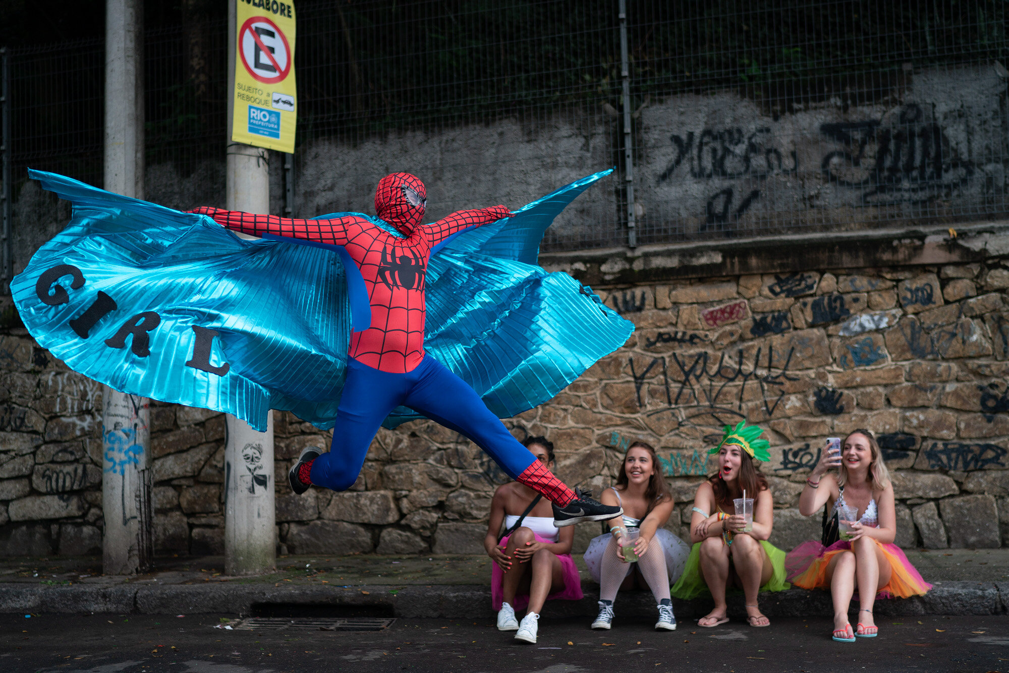 A reveler dressed in a Spider-Man costume strikes a pose at the "Ceu na Terra" or Heaven on Earth street party in Rio de Janeiro, Brazil on Feb. 22, 2020, during the Carnival celebration. (AP Photo/Leo Correa)