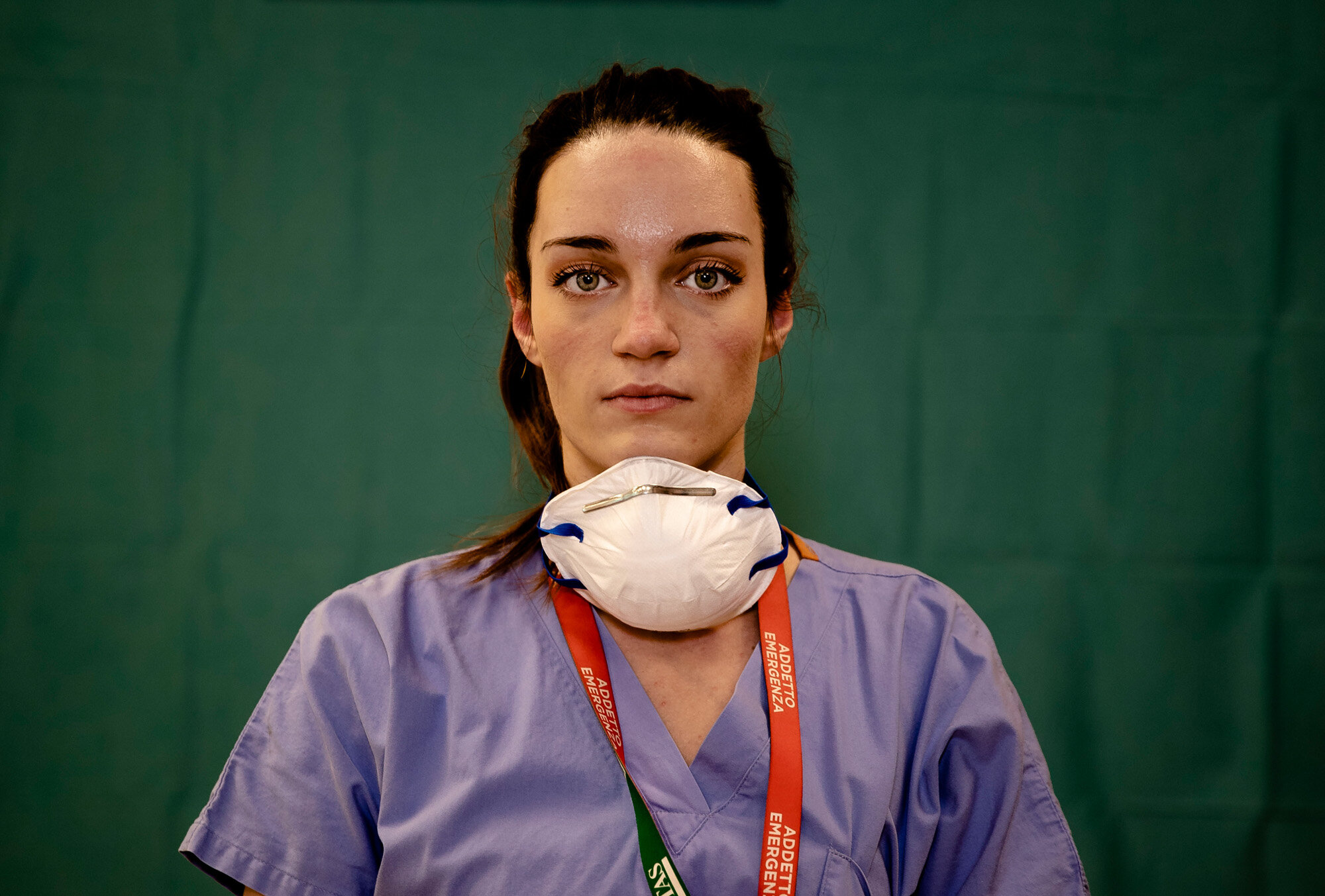 Martina Papponetti, 25, a nurse at the Humanitas Gavazzeni Hospital in Bergamo, Italy, poses for a portrait at the end of her shift on the front lines of the coronavirus pandemic on March 27, 2020. (AP Photo/Antonio Calanni)