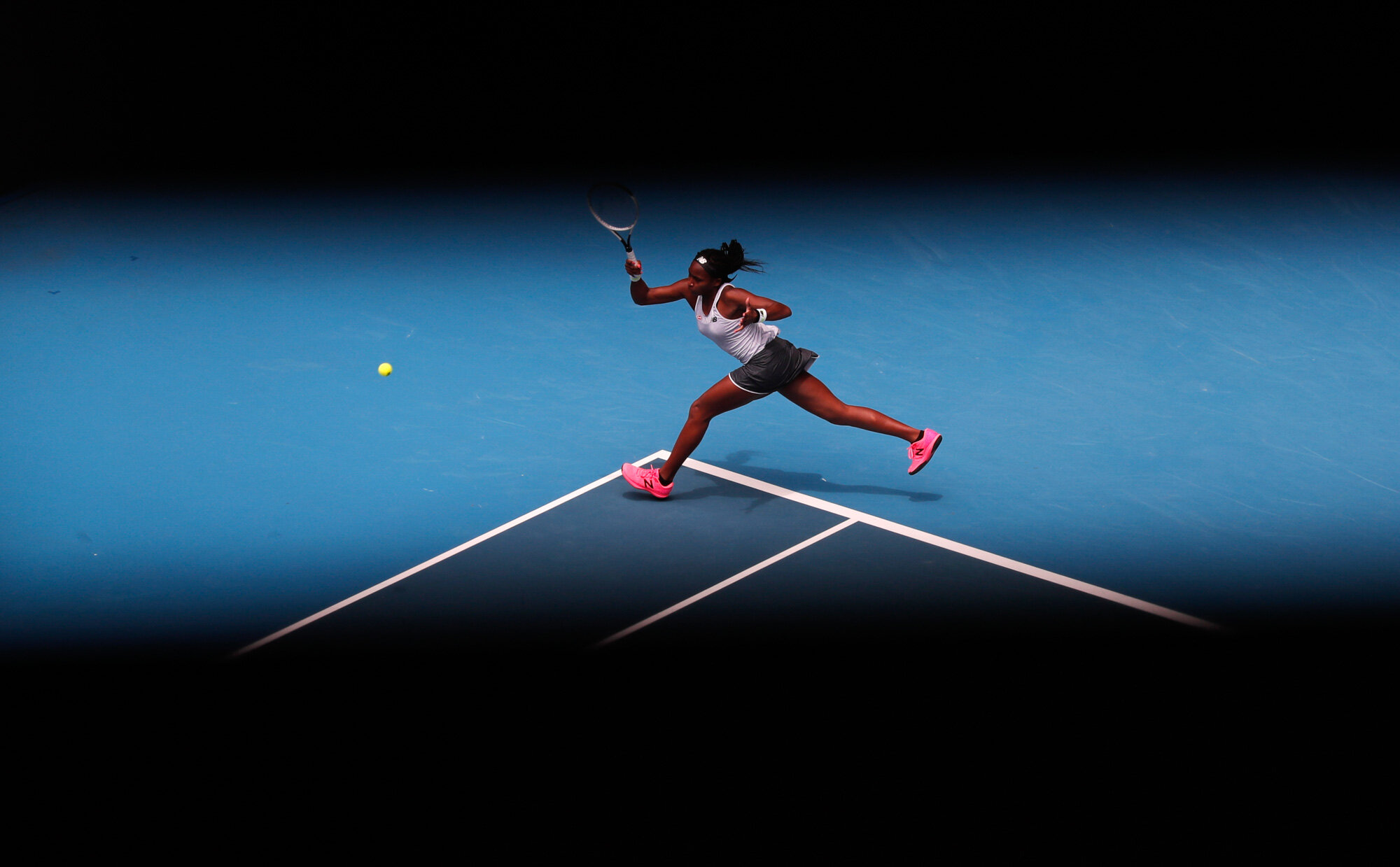 Cori "Coco" Gauff of the U.S. makes a forehand return to Romania's Sorana Cirstea during their second round singles match at the Australian Open tennis championship in Melbourne, Australia, on Jan. 22, 2020. (AP Photo/Lee Jin-man)