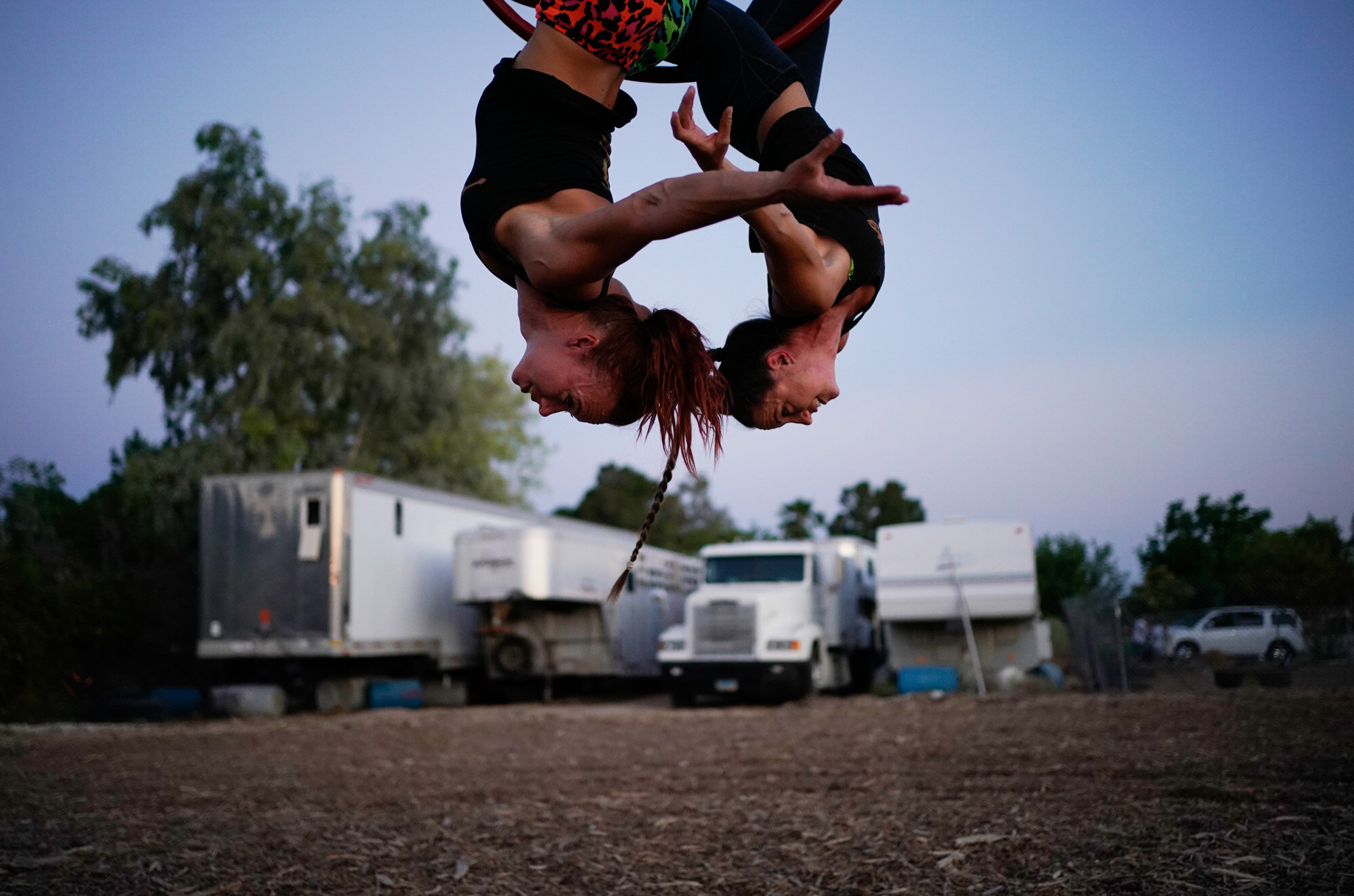 Lisa Varmbo Martonovich, left, and Nicole England-Czyzewski practice an aerial routine for "Gladius The Show," a touring equestrian and acrobatic show, on May 28, 2020, in Las Vegas. The coronavirus forced the producers to cancel all of their performances through 2020. (AP Photo/John Locher)