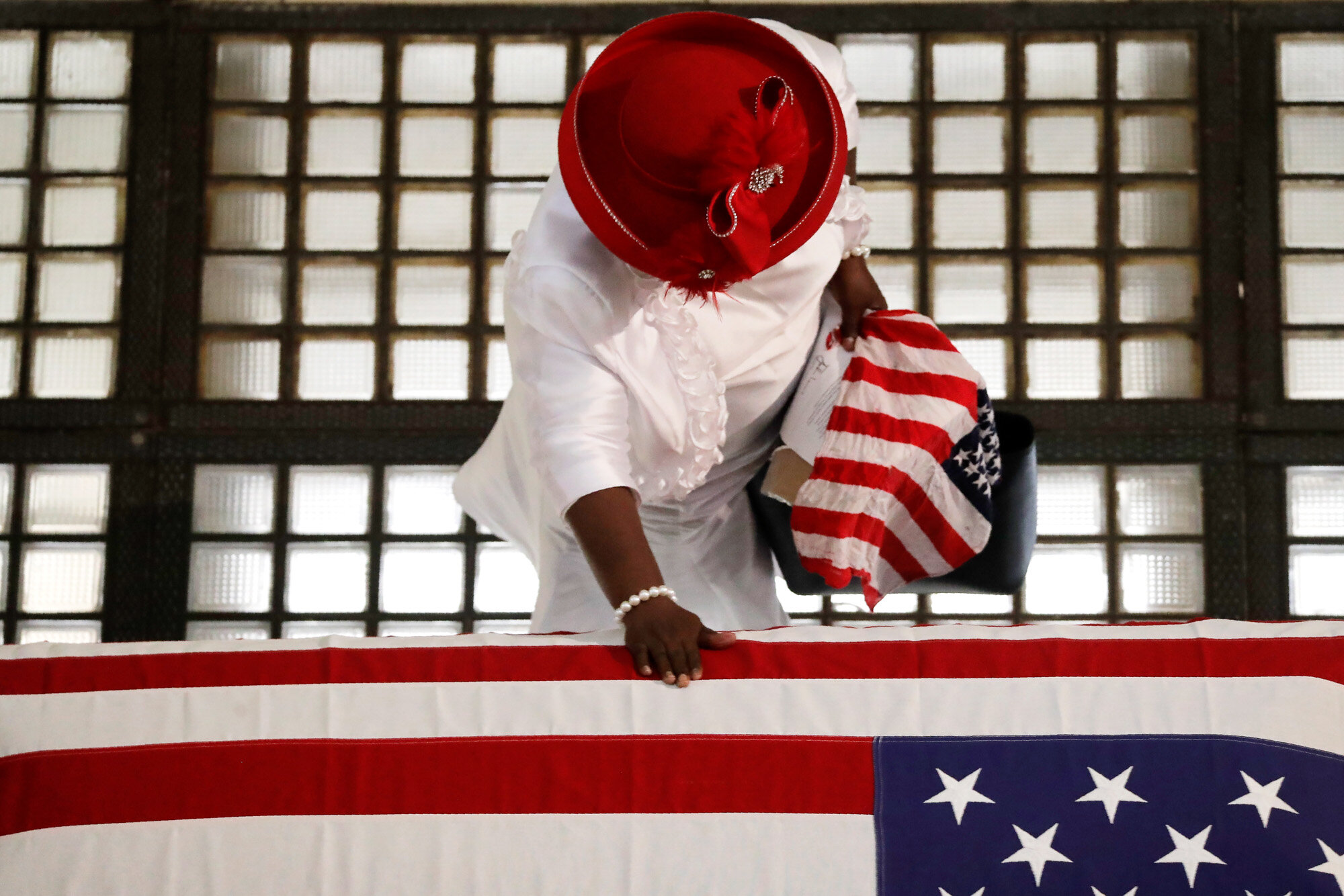 Ga Breedlove pauses by the casket of Rep. John Lewis lying in repose at the Georgia State Capitol in Atlanta on July 29, 2020. Lewis, who carried the struggle against racial discrimination from Southern battlegrounds of the 1960s to the halls of Congress, died on July 17, 2020. (AP Photo/Brynn Anderson)