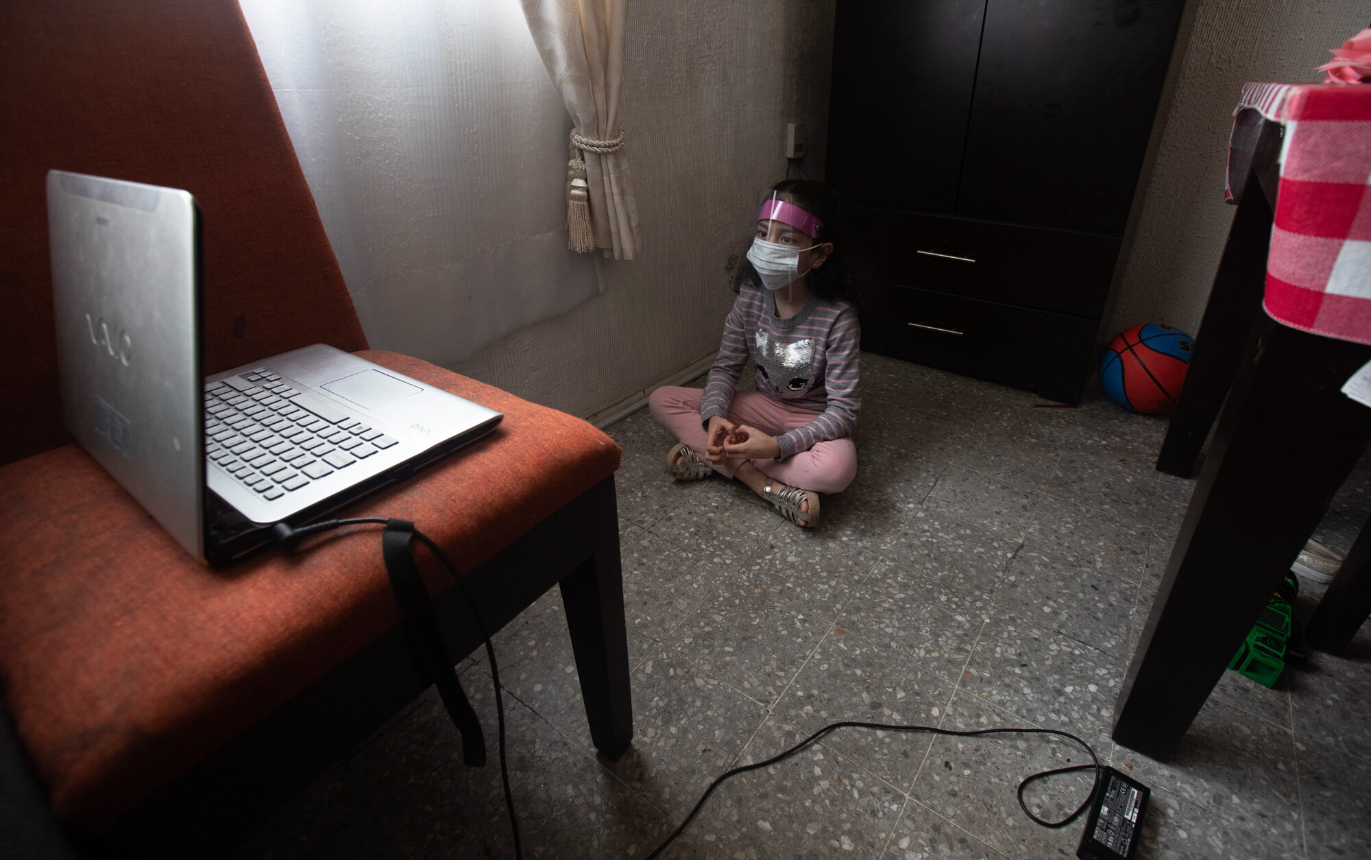 Monserrat Medina Zentella attends school via the internet from her home in Mexico City on Aug. 24, 2020, amid the coronavirus pandemic. (AP Photo/Marco Ugarte)