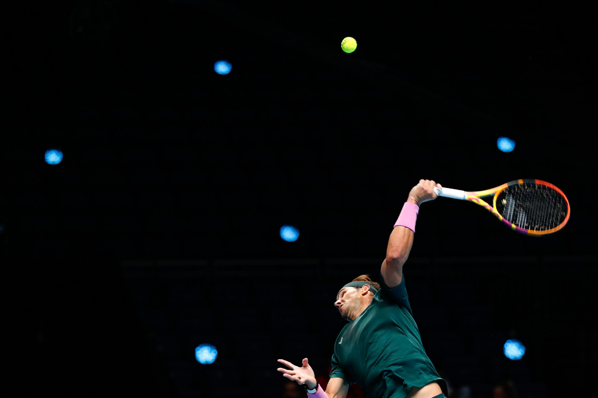  Rafael Nadal of Spain serves to Stefanos Tsitsipas of Greece during their tennis match at the ATP World Finals tennis tournament at the O2 arena in London on Nov. 19, 2020. (AP Photo/Frank Augstein) 