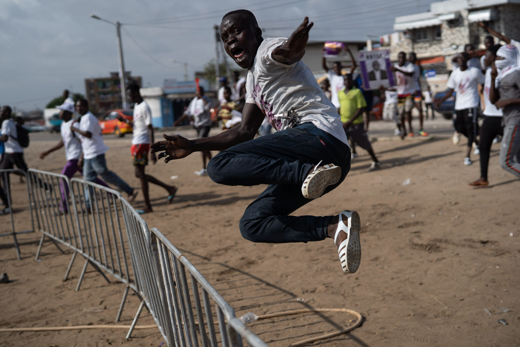  A supporter of presidential candidate Kouadio Konan Bertin jumps a fence as he arrives at Bertin’s final campaign rally in Abidjan, Ivory Coast, on Oct. 29, 2020, ahead of the Oct. 31 election. (AP Photo/Leo Correa) 