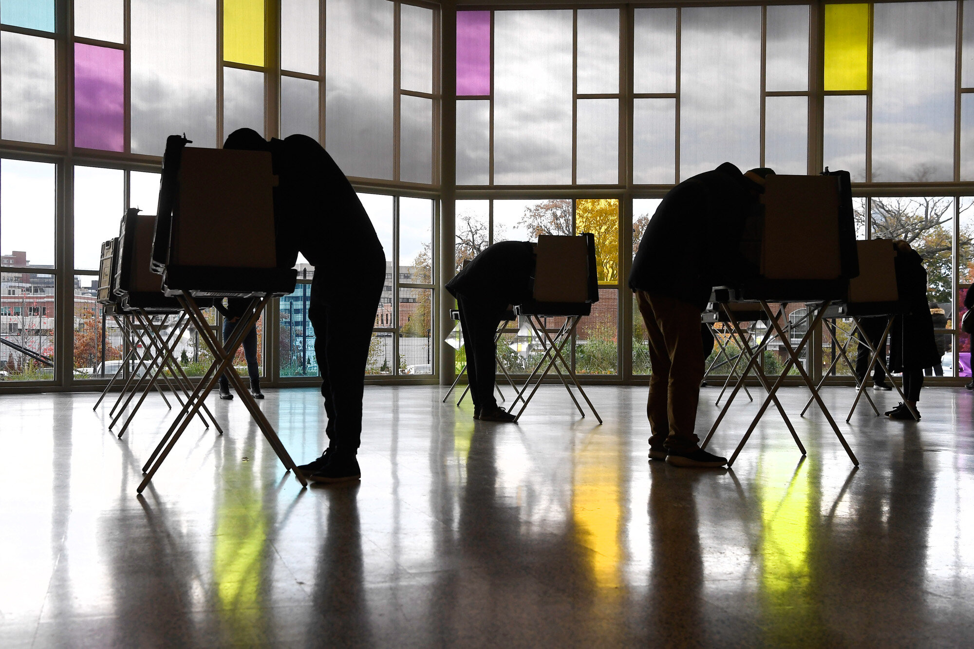 Voters mark their ballots at First Presbyterian Church in Stamford, Conn., on Election Day, Tuesday, Nov. 3, 2020. (AP Photo/Jessica Hill)