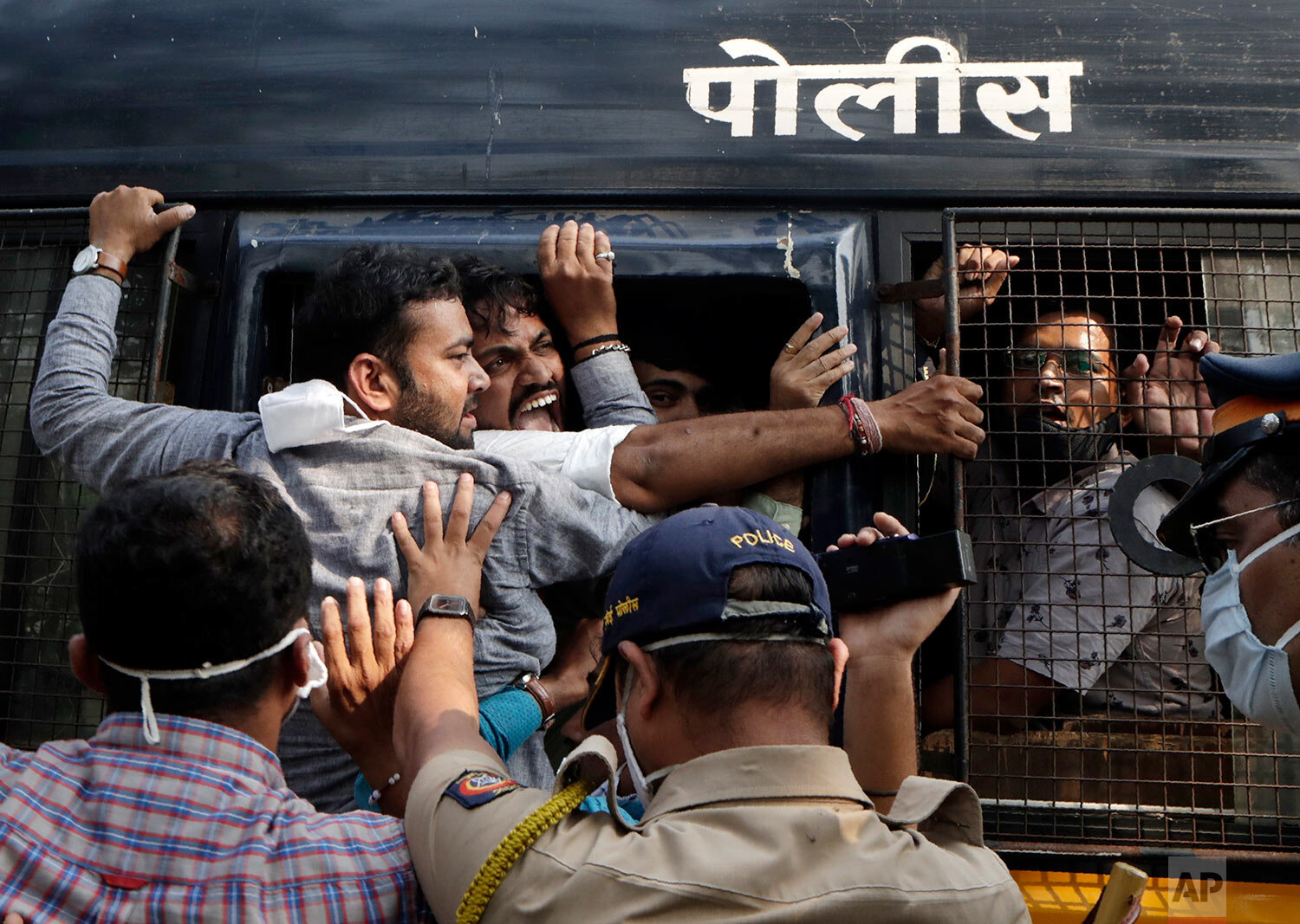  Police detain Bharatiya Janata party workers protesting against Maharashtra state government for the arrest of television news anchor Arnab Goswami in Mumbai, India, Wednesday, Nov. 4, 2020.  (AP Photo/Rajanish Kakade) 