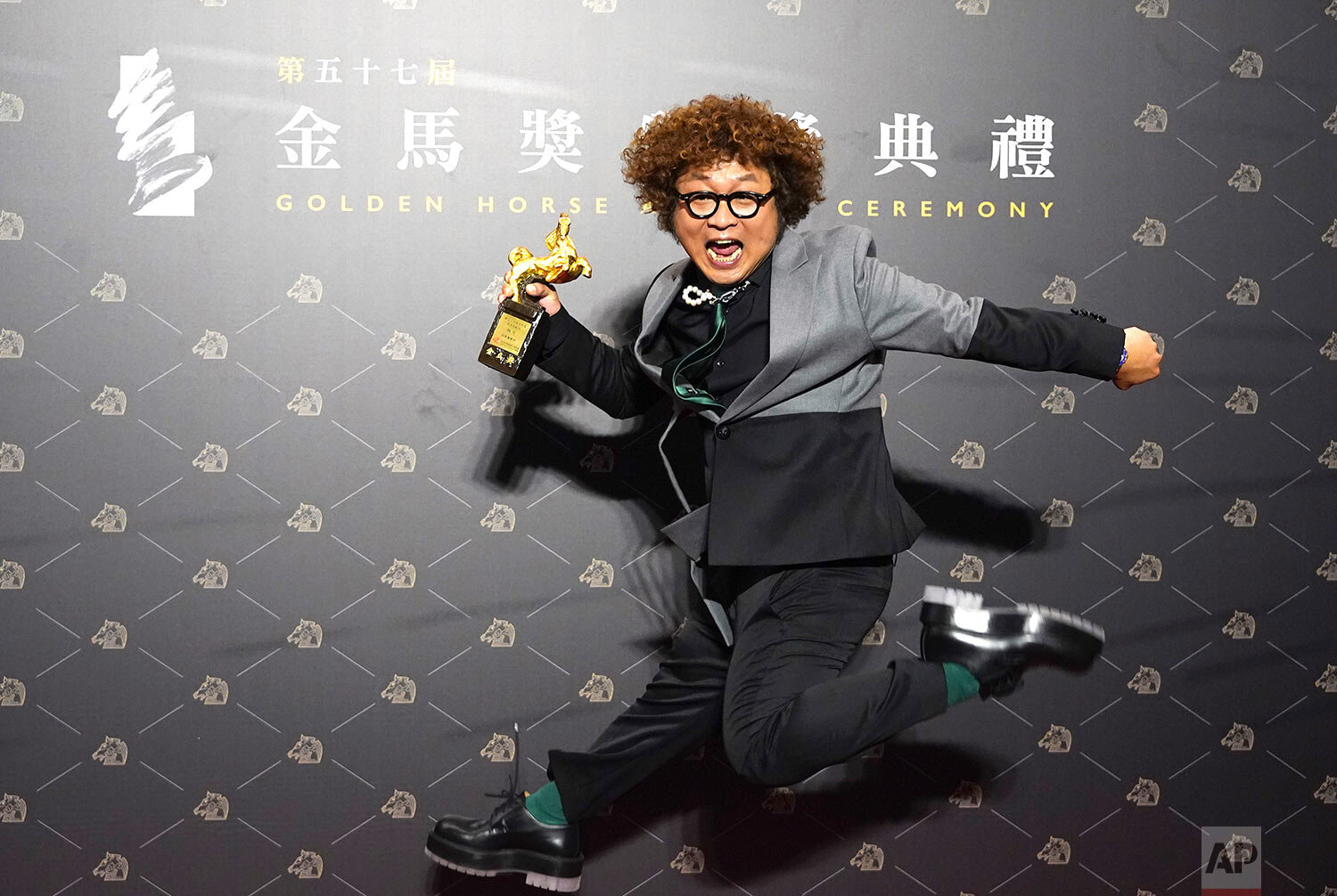  Taiwanese actor Nadow Lin holds his award trophy for Best Supporting Actor at the 57th Golden Horse Awards in Taipei, Taiwan, Saturday, Nov. 21, 2020.  (AP Photo/Billy Dai) 
