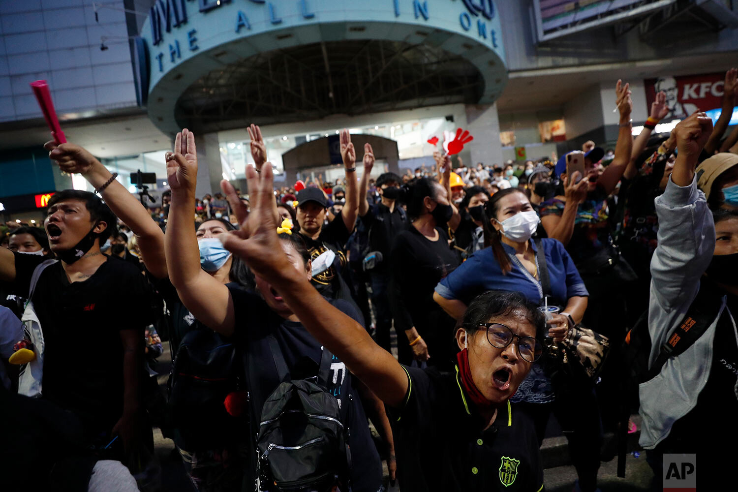  Protesters flash three-finger protest gestures as they gather to march in Bangkok, Thailand, Saturday, Nov. 28, 2020.  (AP Photo/Sakchai Lalit) 