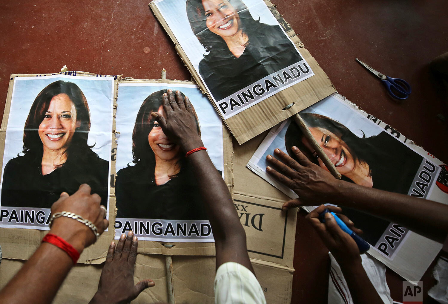  Villagers prepare placards featuring U.S. democratic vice presidential candidate Sen. Kamala Harris, as they prepare to celebrate should the Democratic Party win the presidential elections, in Painganadu a neighboring village of Thulasendrapuram, so