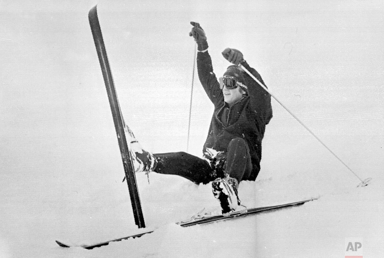  John Lennon, member of the British pop group The Beatles, falls while skiing while on holiday, near St. Moritz, Switzerland, Jan. 28, 1965. (AP Photo) 