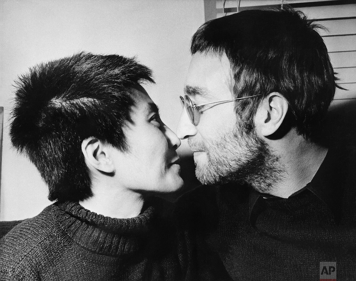  John Lennon and his wife Yoko Ono share an Eskimo kiss (rubbing noses) during an interview in London, Feb. 9, 1970.  Both had their hair shorn in Denmark to be auctioned off in London. The proceeds will go to the Black Power organization in Britain.