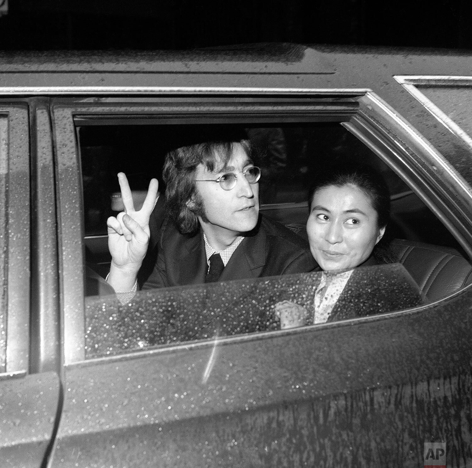  Former Beatle John Lennon, left, and his wife Yoko Ono, leave the Immigration and Naturalization Service, at 20 West Broadway, March 16, 1972, New York. His case was postponed and comes up in April. (AP Photo/Anthony Camerano) 