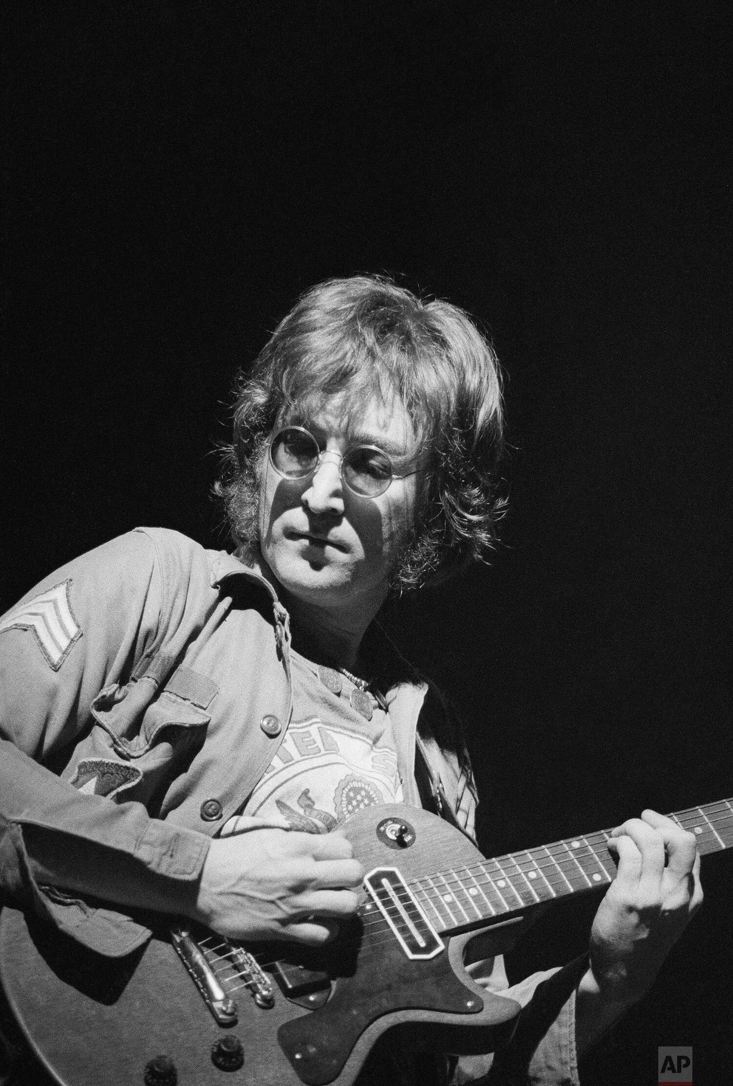  Former Beatle John Lennon performs during the One To One concert, a charity to benefit mentally challenged children at New York's Madison Square Garden, Aug. 30, 1972. (AP Photo) 