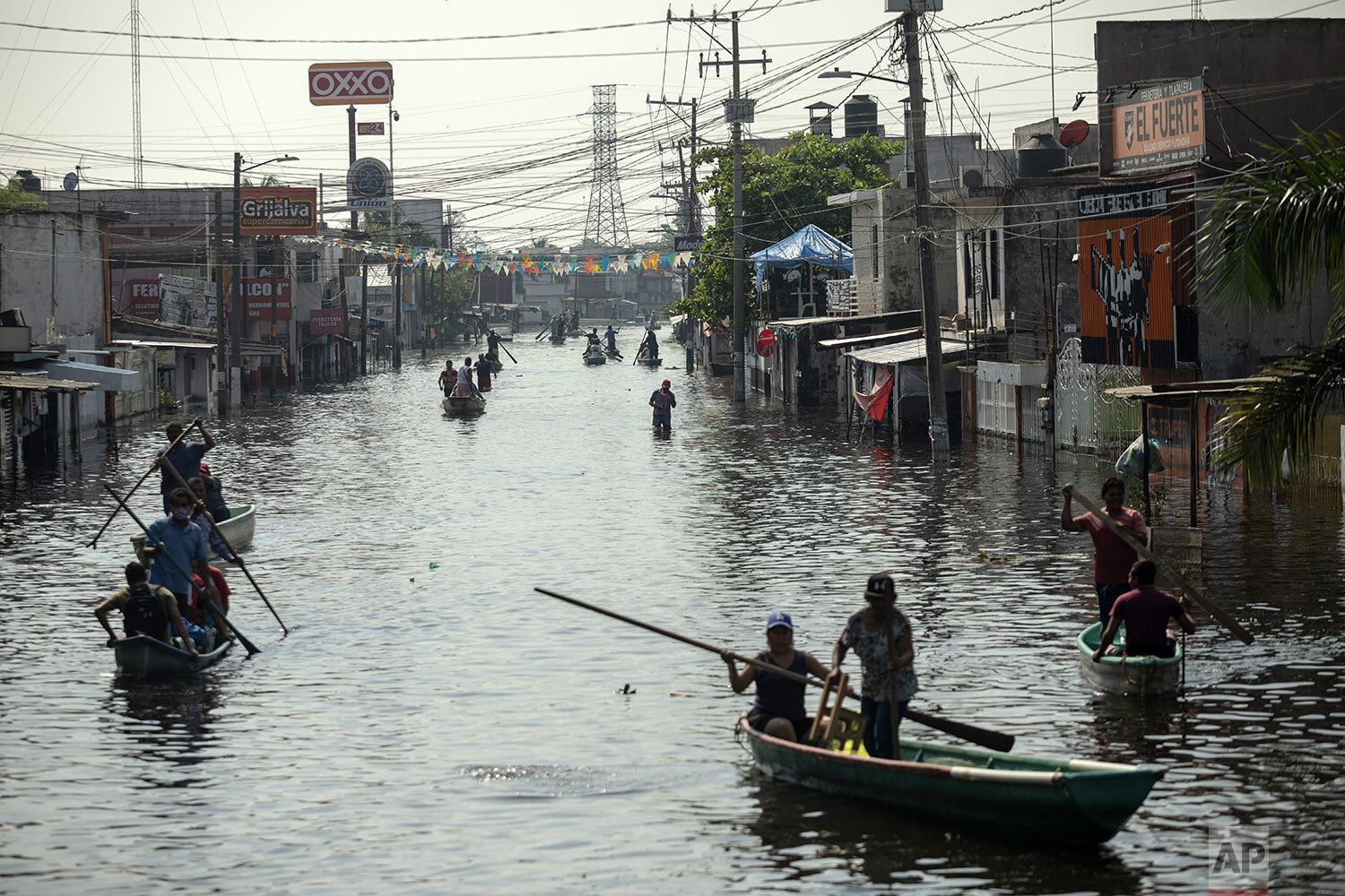  Residents uses boats to navigate the flooded streets in Villahermosa, Mexico, Wednesday, Nov. 11, 2020.  (AP Photo/Felix Marquez) 