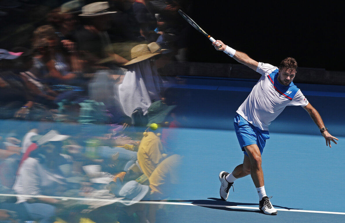  Switzerland's Stan Wawrinka makes a backhand return to Damir Dzumhur of Bosnia and Herzegovina during their first round singles match at the Australian Open tennis championship in Melbourne, Australia, Tuesday, Jan. 21, 2020. (AP Photo/Andy Wong, Fi