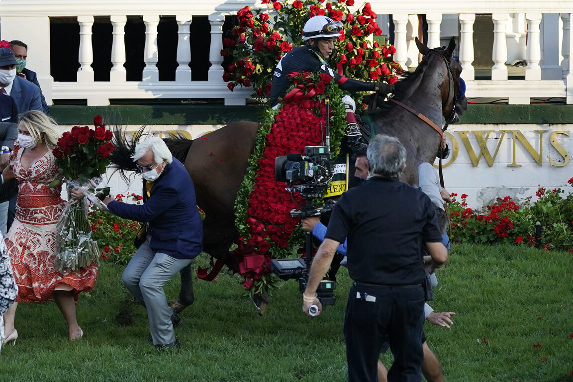  Trainer Bob Baffert is knocked to ground as jockey John Velazquez tries to control his horse Authentic in the winners' circle after winning the 146th running of the Kentucky Derby at Churchill Downs, Saturday, Sept. 5, 2020, in Louisville, Ky. (AP P