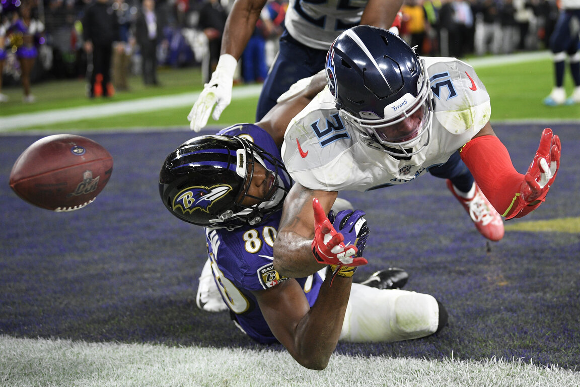  Baltimore Ravens wide receiver Miles Boykin misses the catch on a two-point conversion against Tennessee Titans free safety Kevin Byard during the second half of an NFL divisional playoff football game, Saturday, Jan. 11, 2020, in Baltimore. (AP Pho