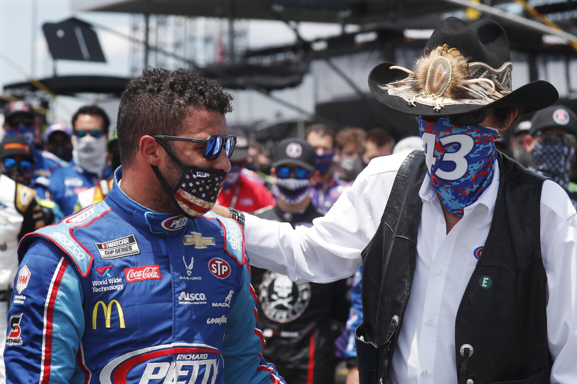  Team owner Richard Petty, right, consoles driver Bubba Wallace prior to the start of the NASCAR Cup Series at the Talladega Superspeedway in Talladega, Ala., Monday, June 22, 2020. (AP Photo/John Bazemore) 
