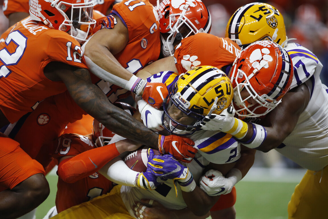  LSU wide receiver Justin Jefferson (2) is tackled by Clemson during the first half of an NCAA College Football Playoff national championship game in New Orleans, Monday, Jan. 13, 2020. (AP Photo/Gerald Herbert) 