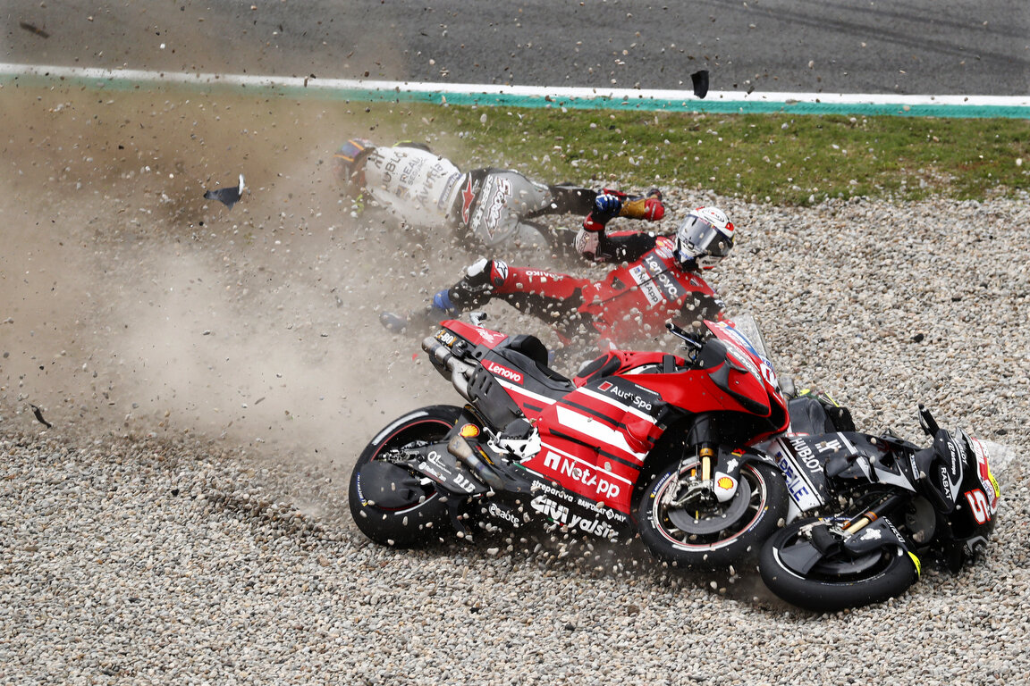  MotoGP rider Johann Zarco of France, left, looses control of his bike and crashes into championship leader Andrea Dovizioso of Italy during the Catalunya Motorcycle Grand Prix at the Barcelona Catalunya racetrack in Montmelo, near Barcelona, Spain, 