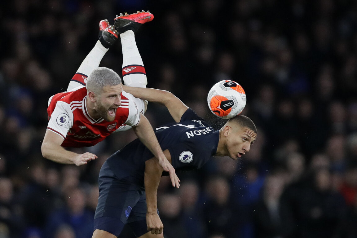  Everton's Richarlison, right, fights for the ball with Arsenal's Shkodran Mustafi during the English Premier League soccer match between Arsenal and Everton at Emirates stadium in London, Sunday, Feb. 23, 2020. (AP Photo/Kirsty Wigglesworth) 