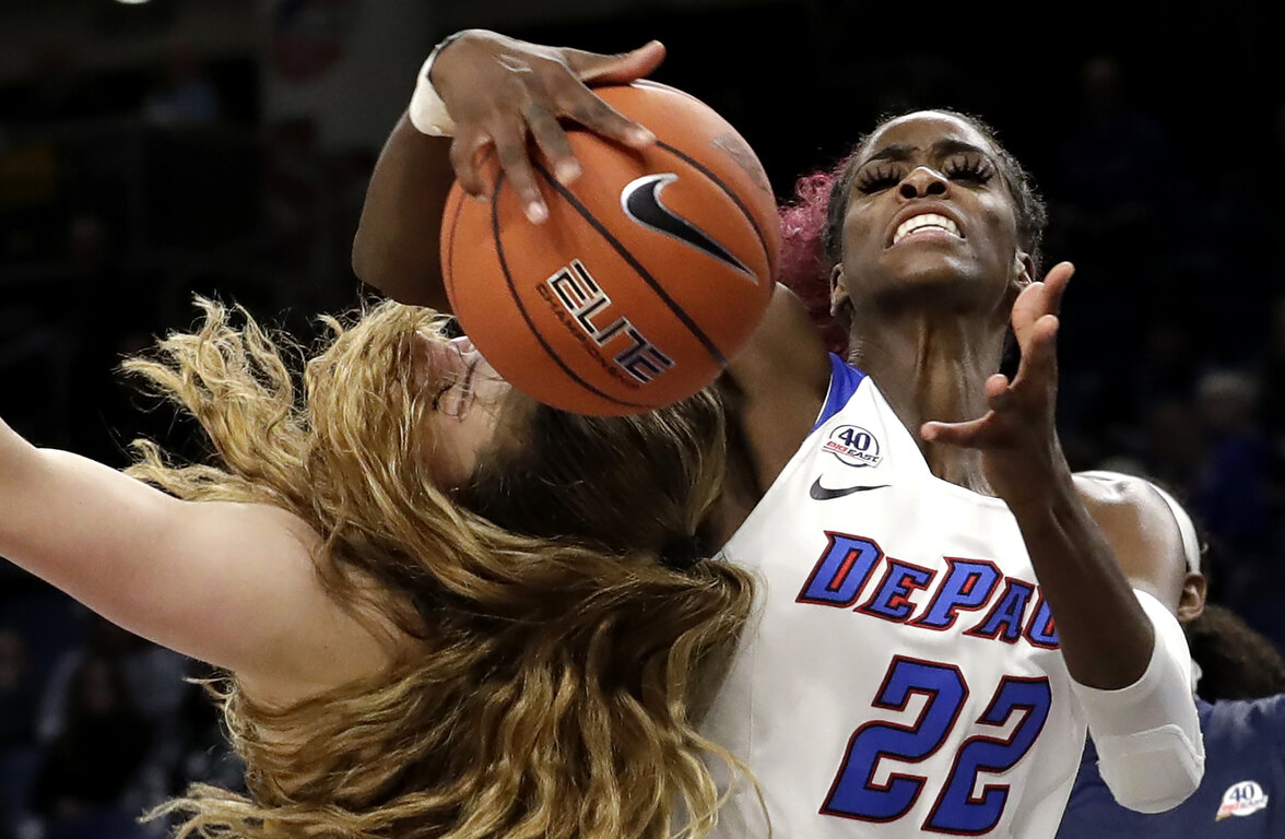  DePaul forward Chante Stonewall battles a rebound against Marquette forward Chloe Marotta during the second half of an NCAA college basketball game in the Big East women's tournament final, Monday, March 9, 2020, in Chicago. (AP Photo/Nam Y. Huh) 